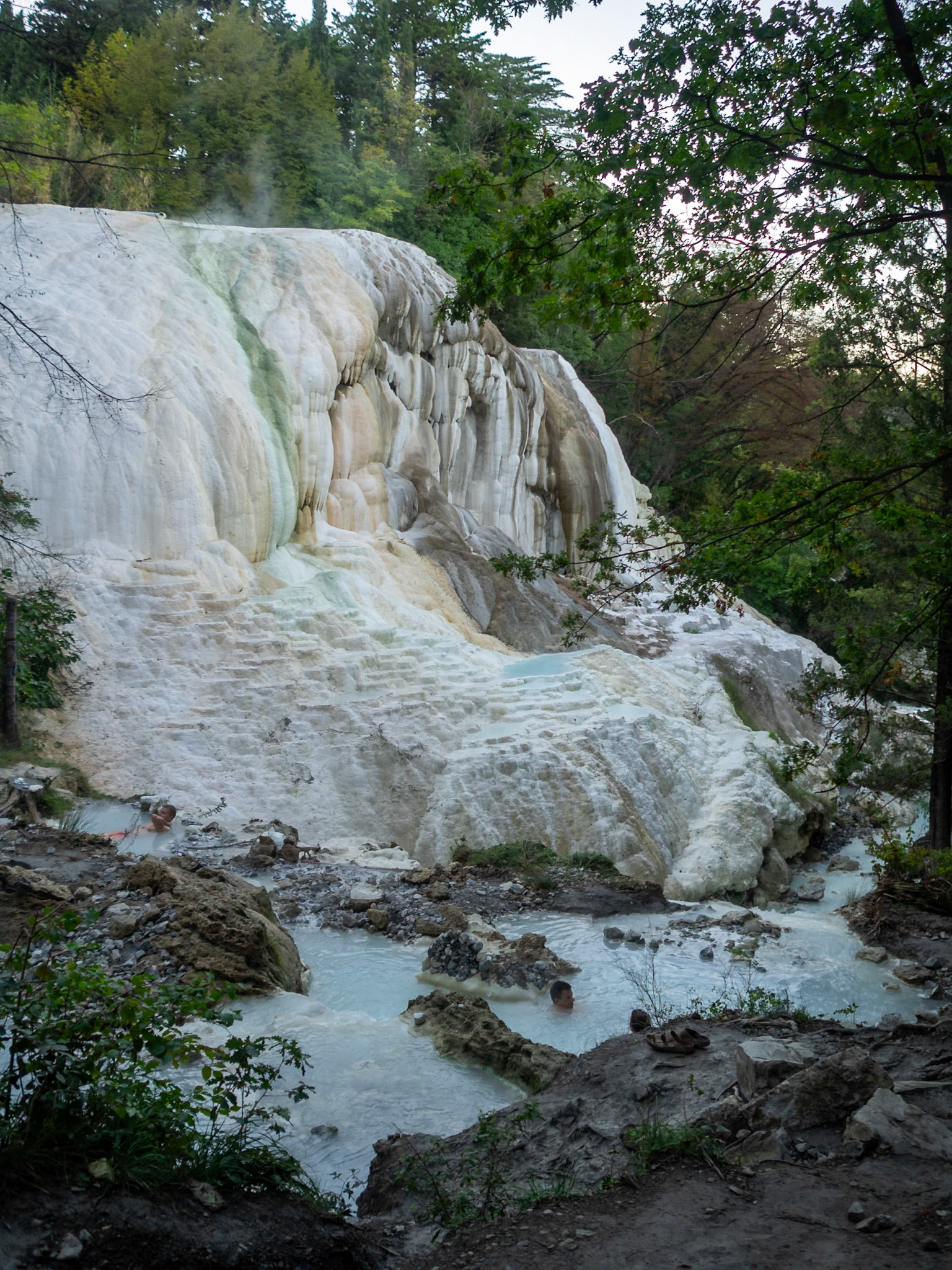 Bagni San Filippo hot spring with the water pond at the base of the calcium carbonate  formation