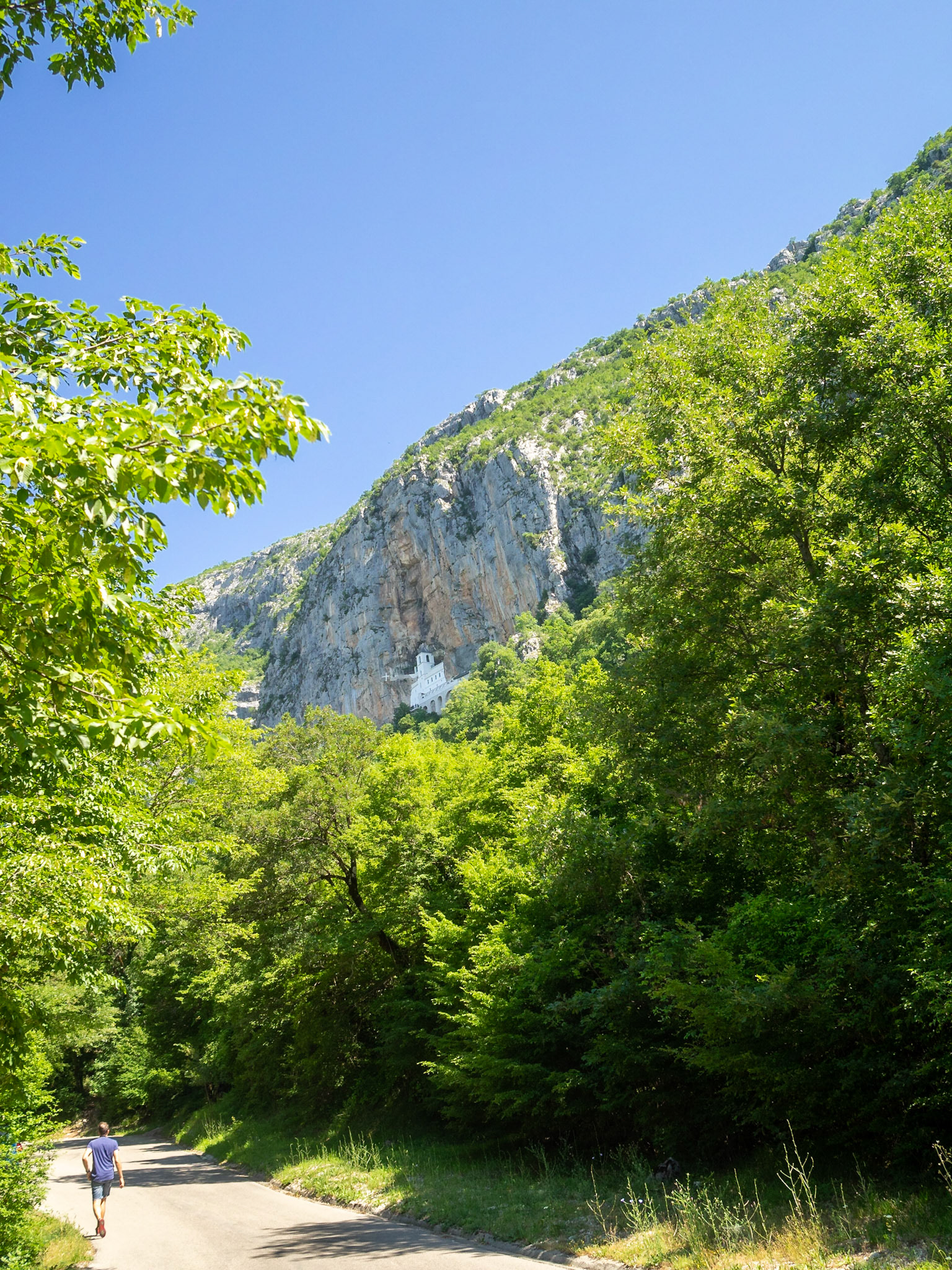 Ostrog Monastery high up in the rock of Ostroška Greda above the road