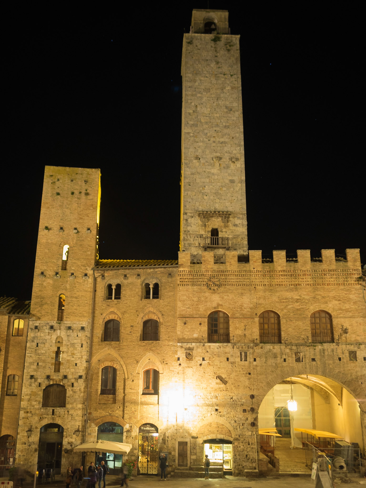 At night in San Gimignano streets under the towers