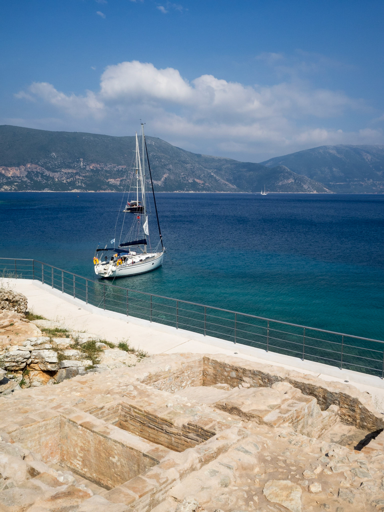 Ruins and boat in Fiskardo bay