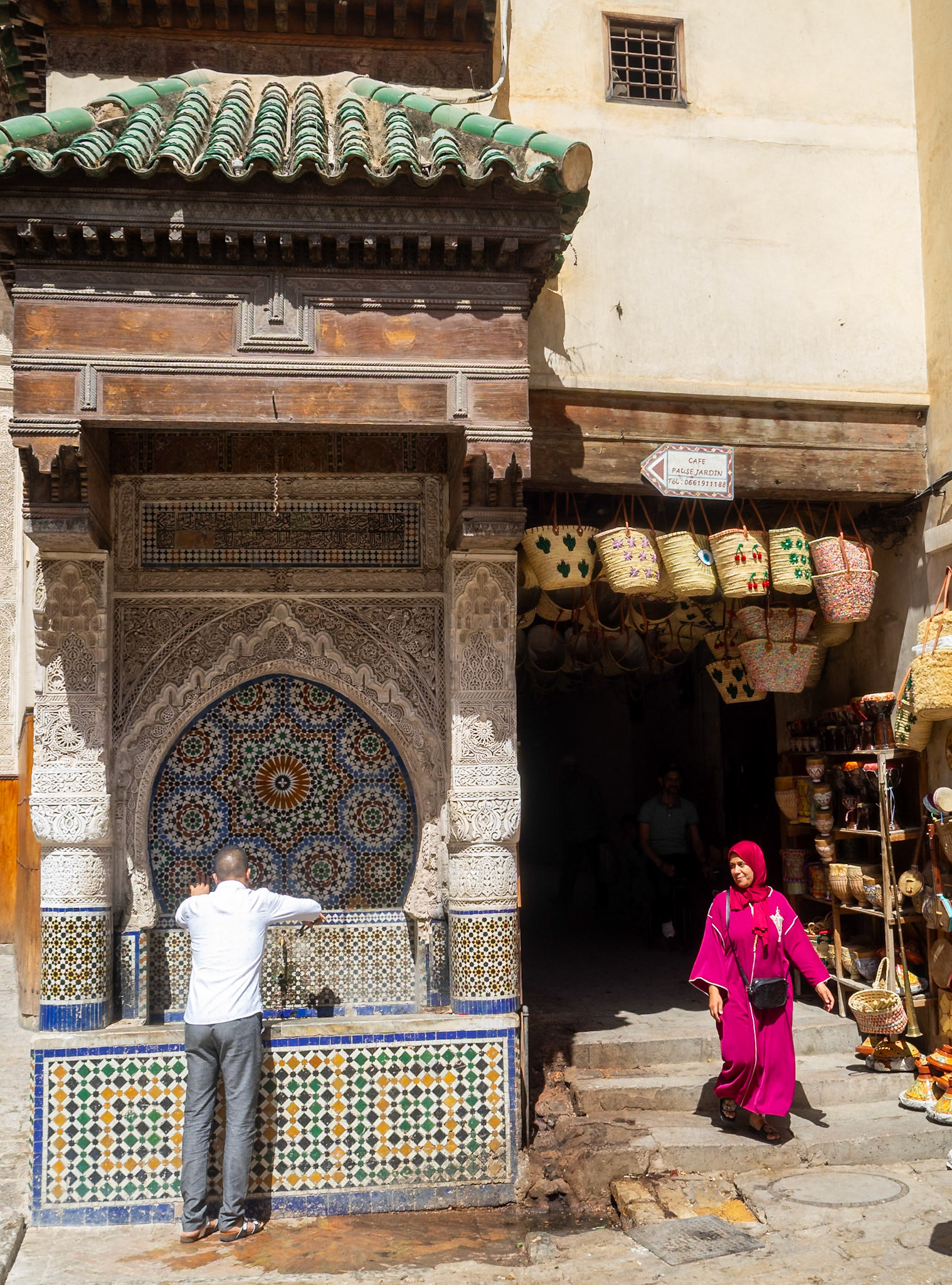 Drink at a fountain in Fez medina, Morocco