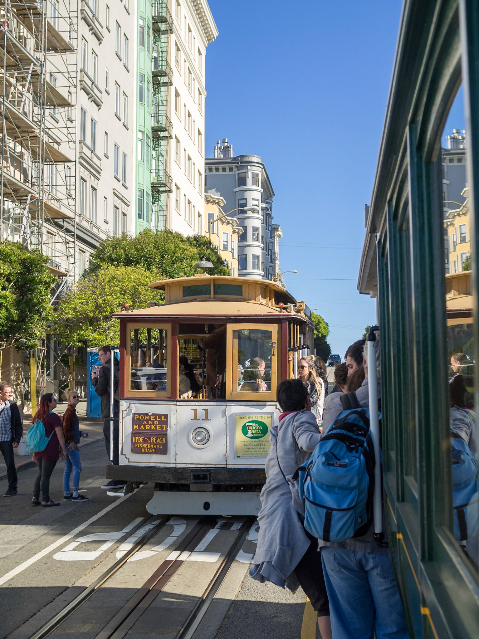 Riding outside a cable car in San Francisco streets