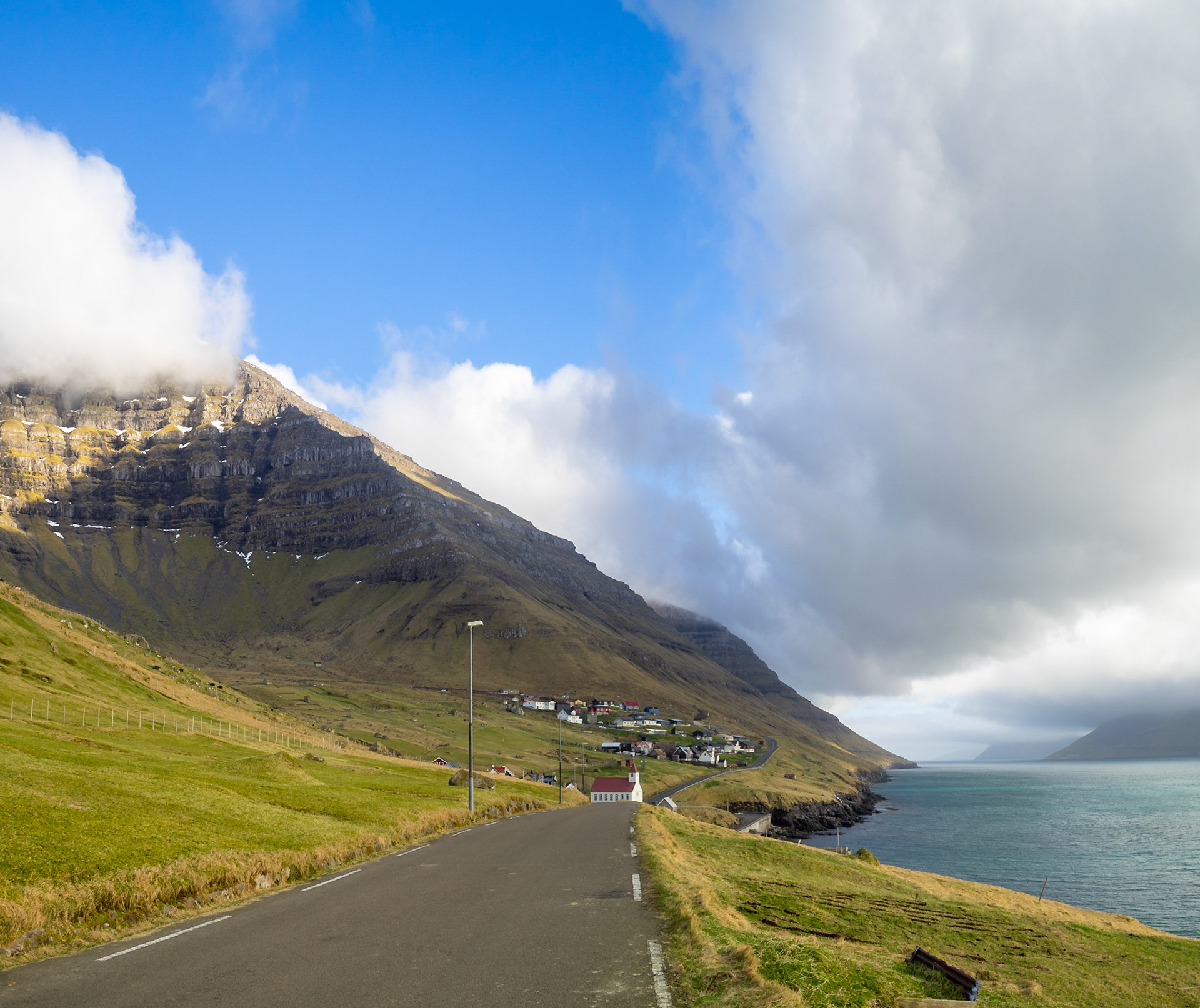 Road along Kalsoyarfjørður fjord in Kunoy island