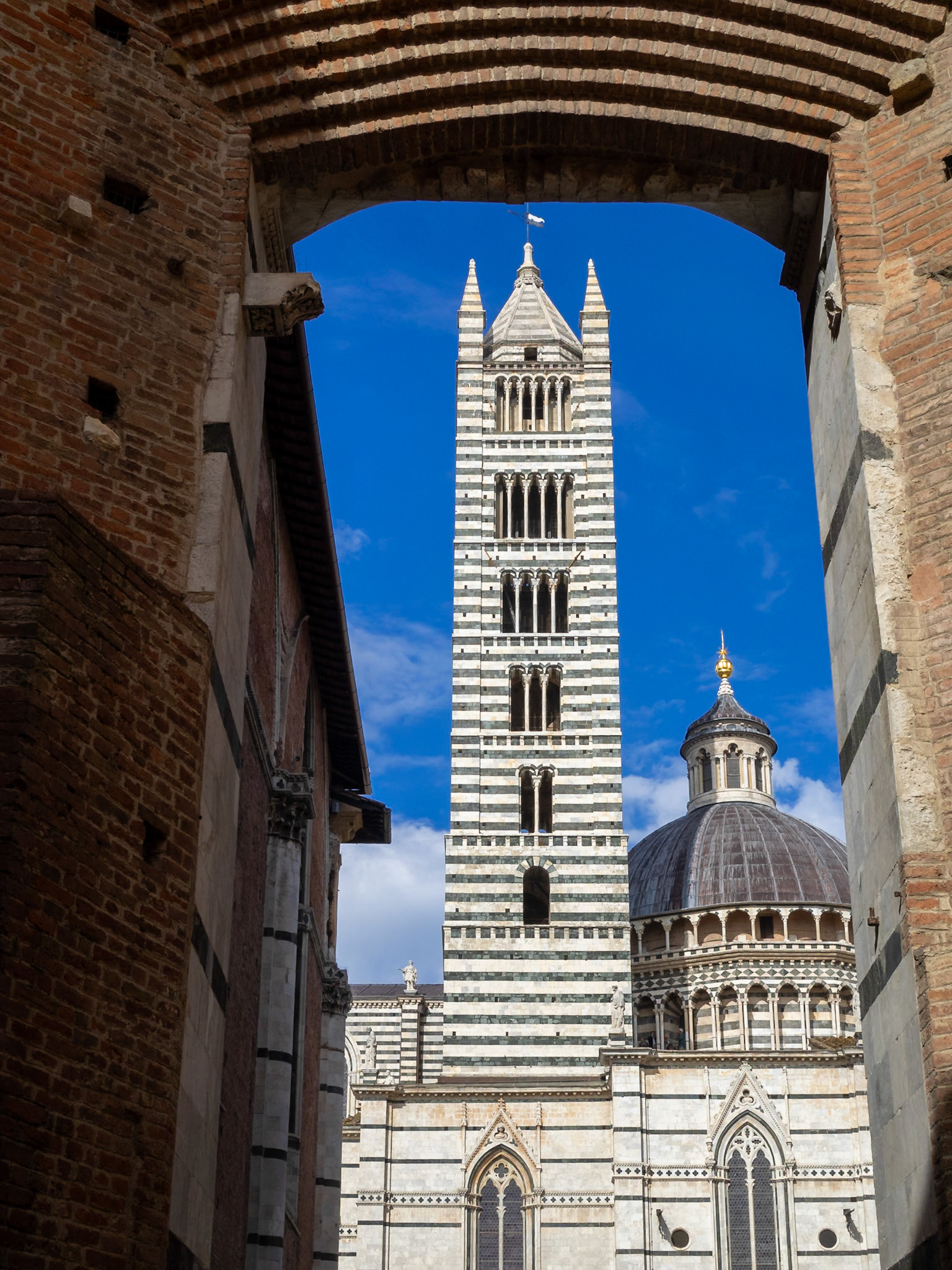 Siena Duomo bell tower framed by the Facciatone