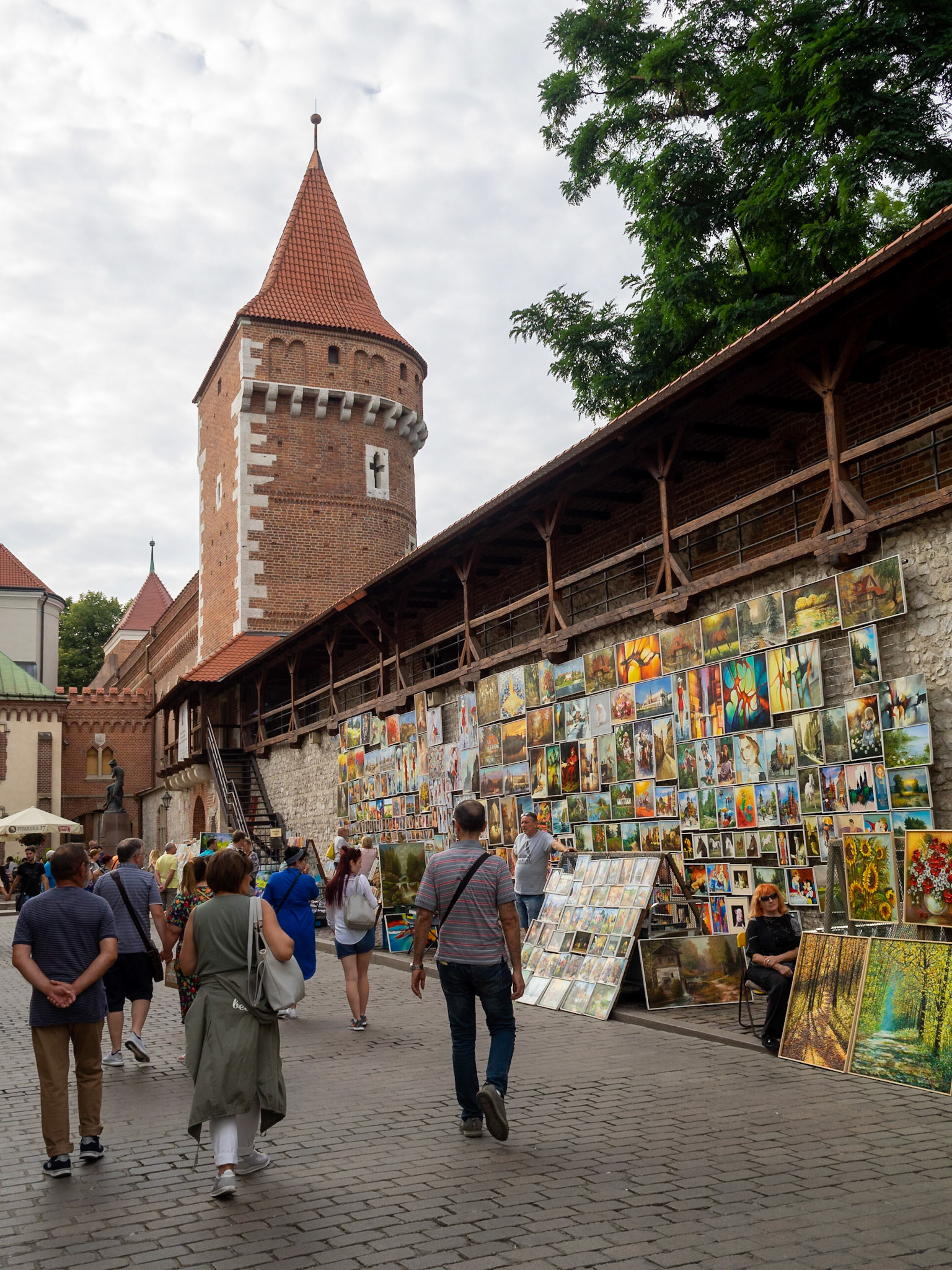 Selling paintings by Krakow city wall