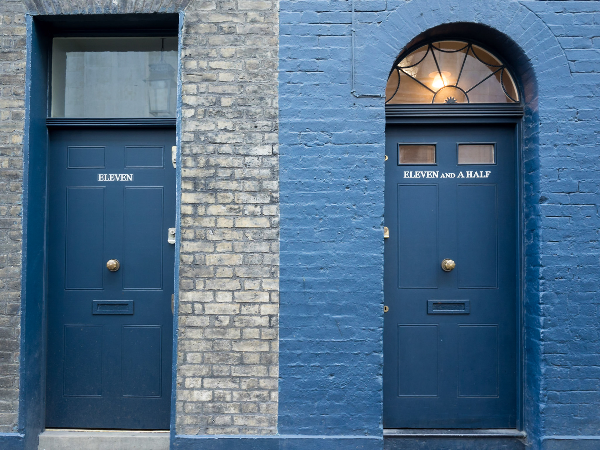 Contrasting round and square top doors in blue and gray