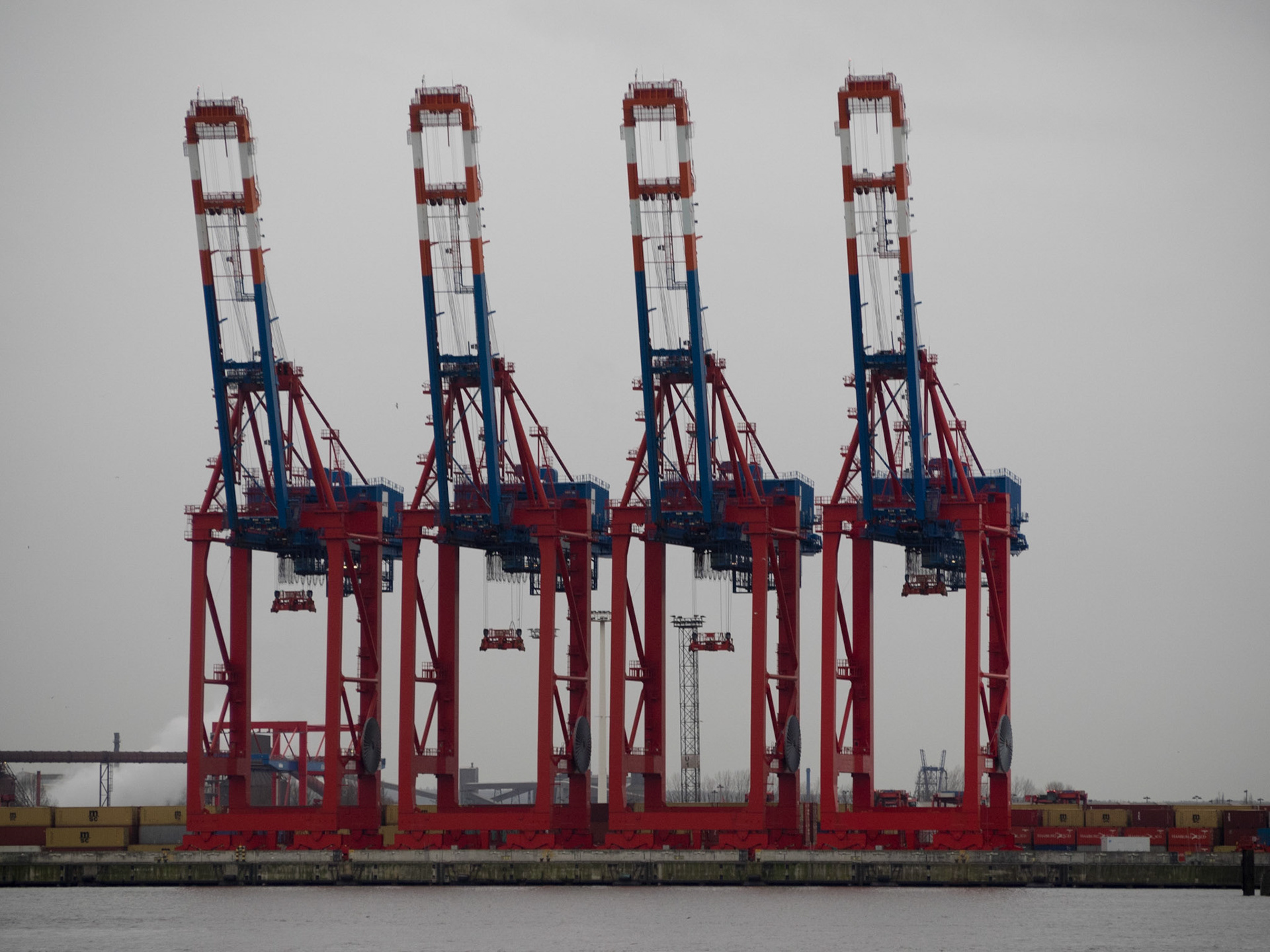 Cranes lined by the Elbe river in Hamburg port