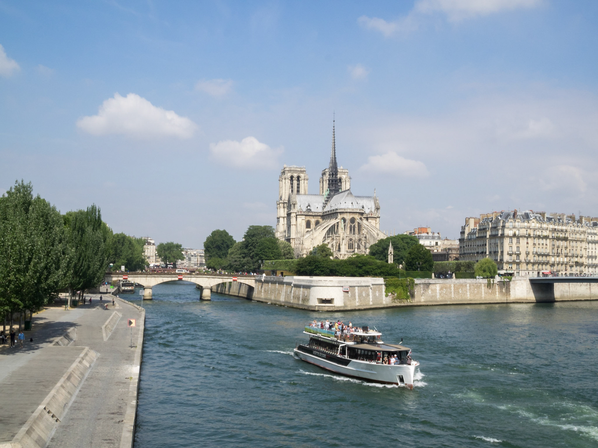 Notre-Dame de Paris and a boat on the Seine river