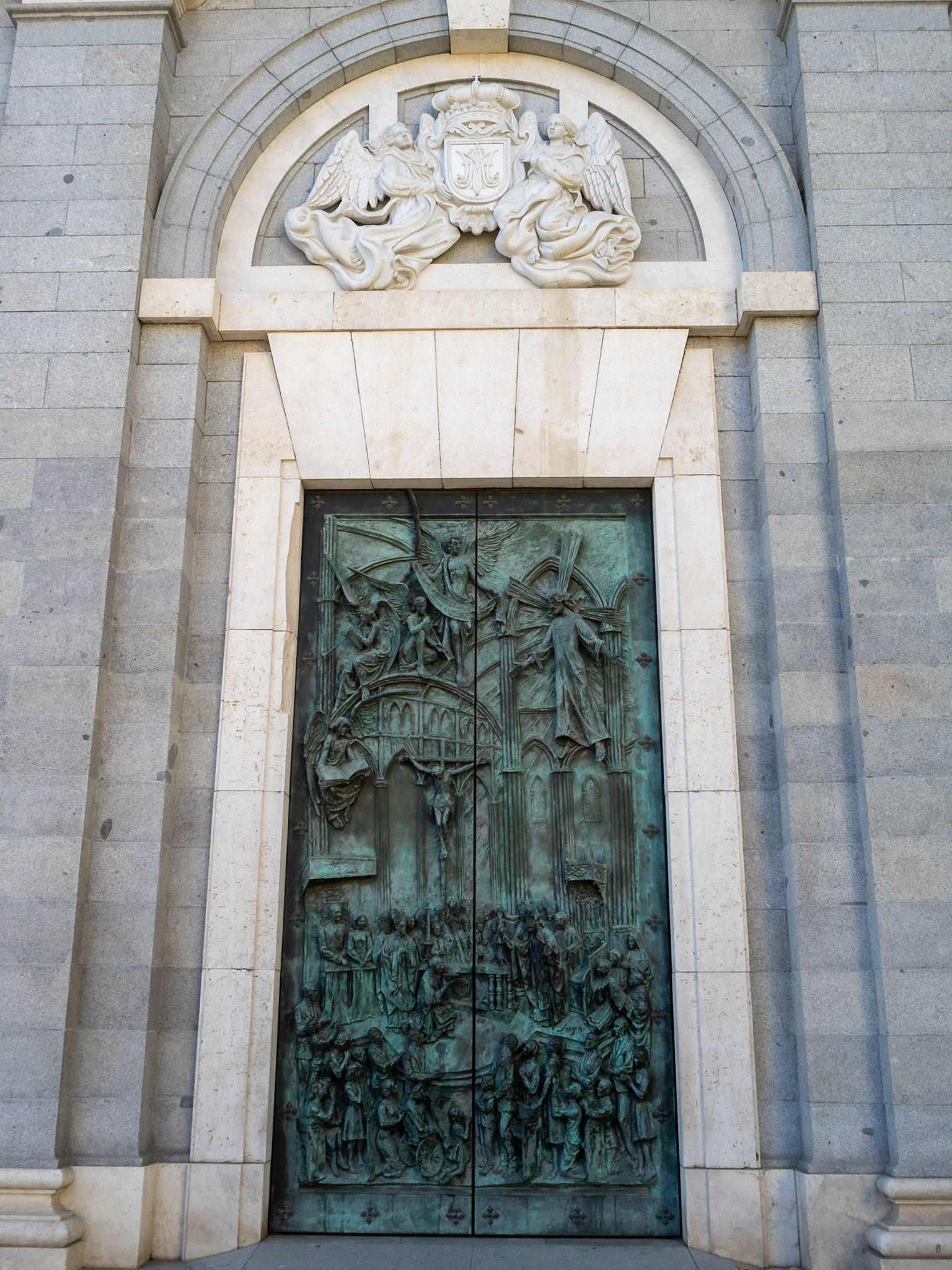 Bronze door of the Almudena Cathedral bailen facade, depicting the day of the cathedral consecration by Pope John Paul II, Madrid