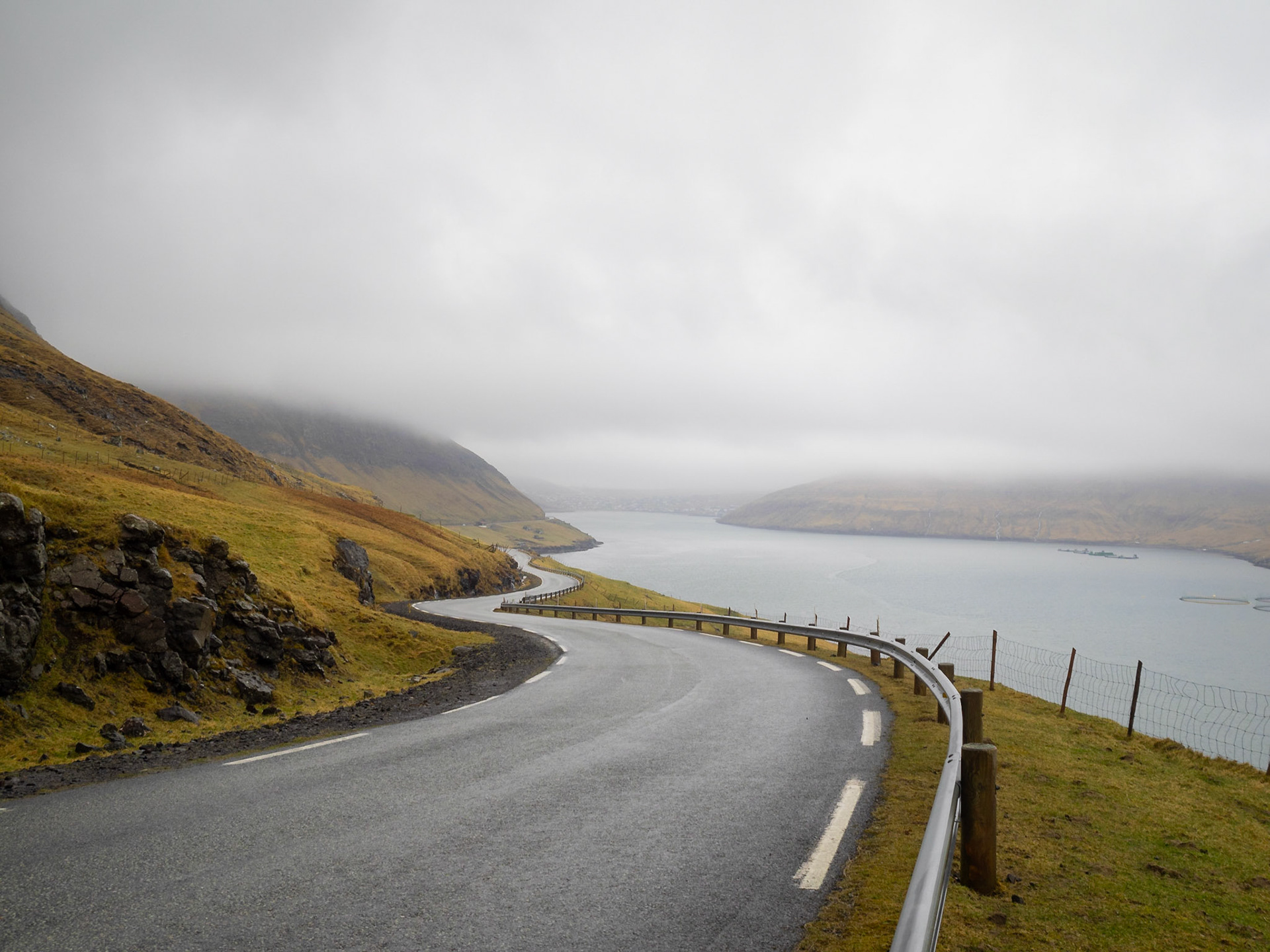 Winding road along Sørvágur fjord