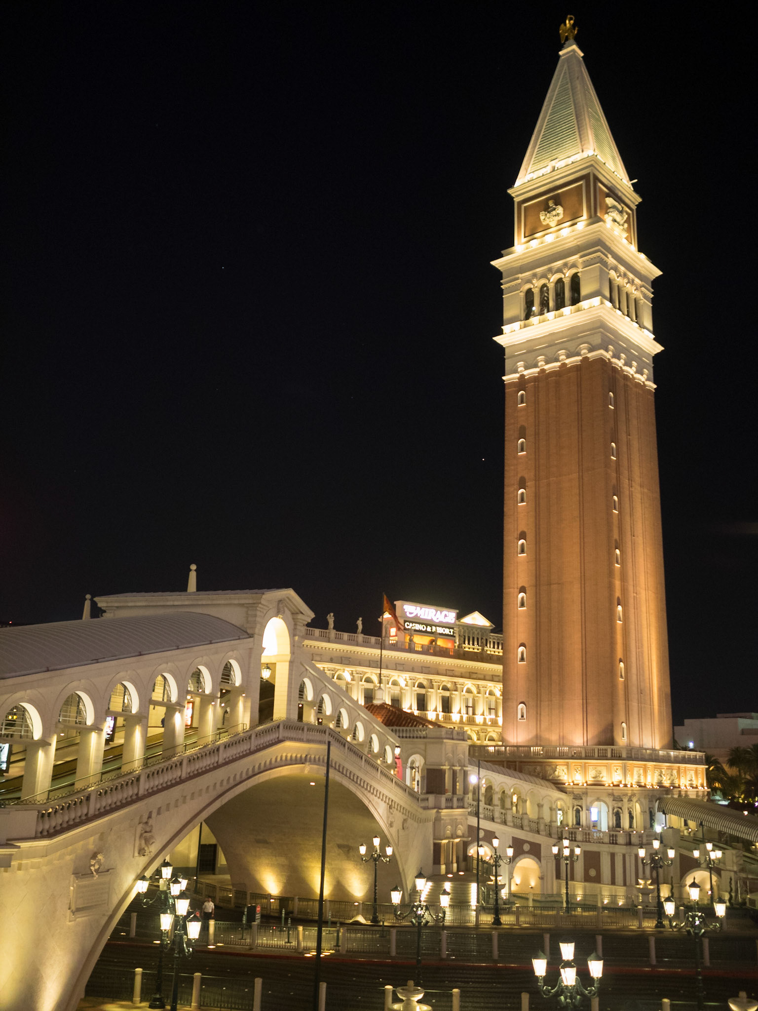 The tower and covered bridge of The Venetian at night