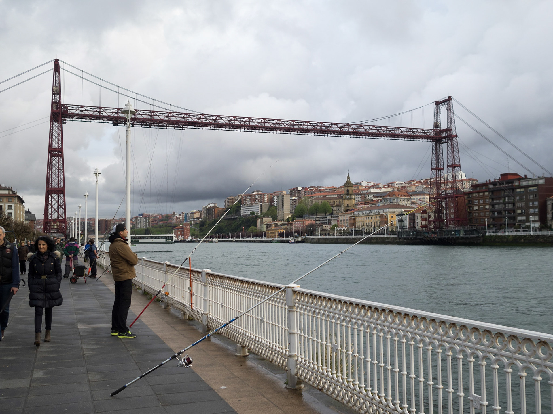 Fishing in the river in Las Arenas with Vizcaya Bridge in background