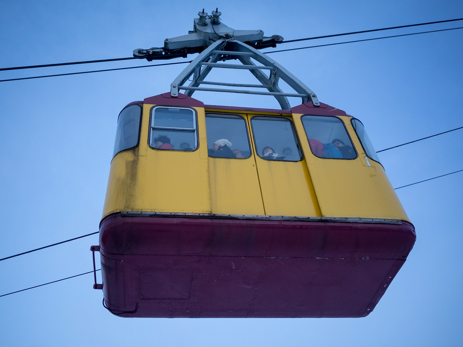 looking up to the cable car cabin over the Arctic Circle snow covered landscape of Tromso
