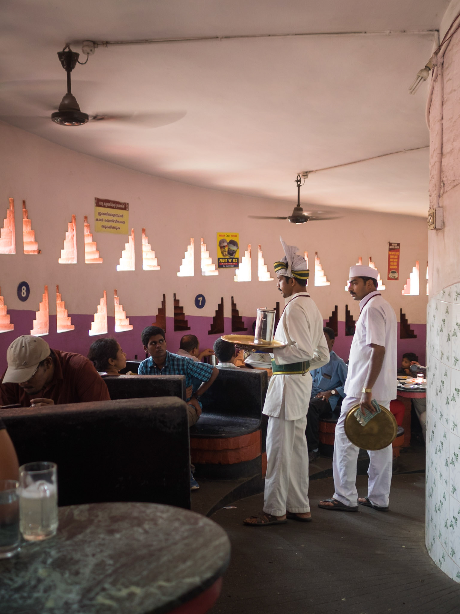 Waiters and clients inside the Indian coffee House in Trivandrum