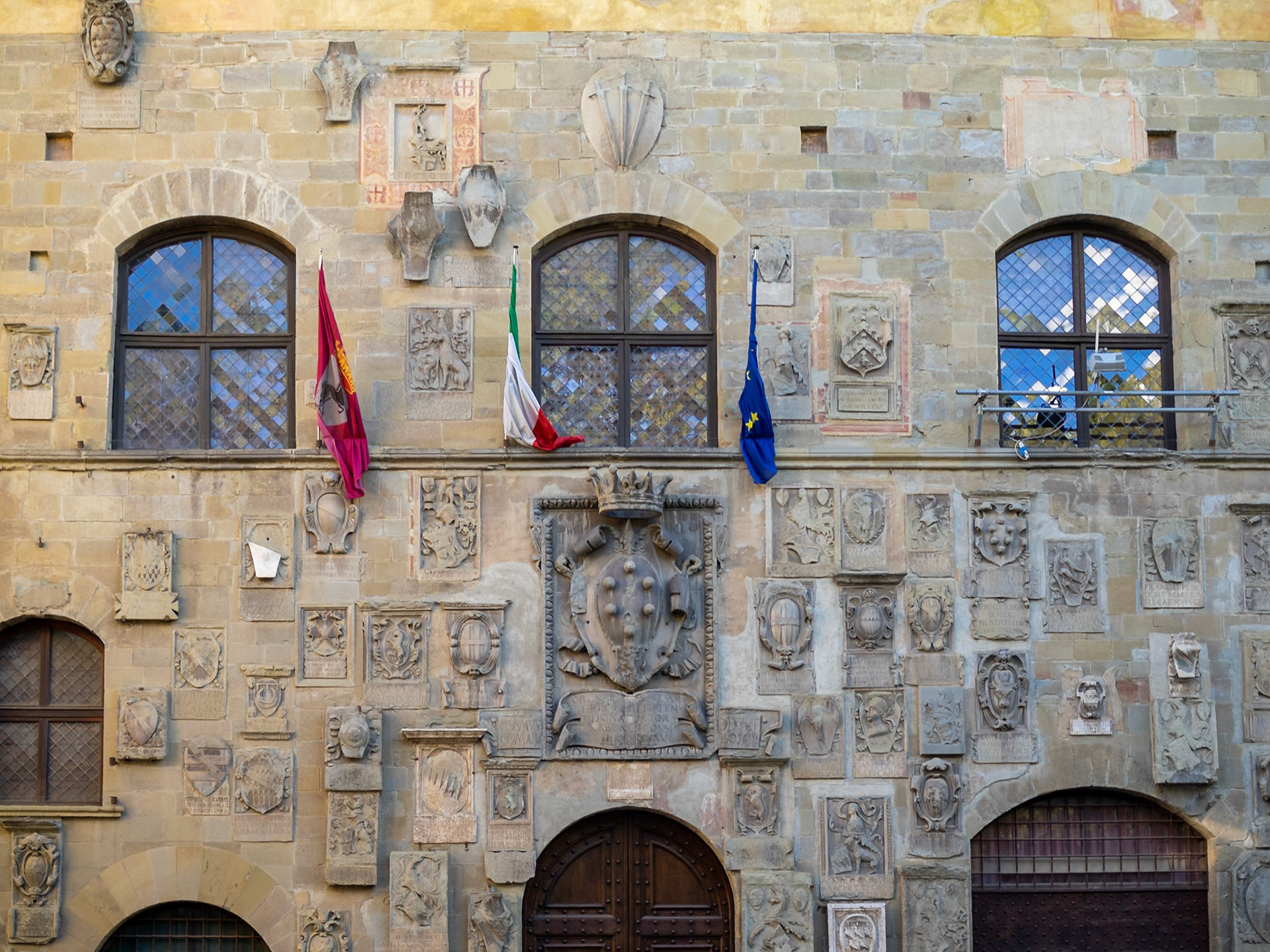 Pretorio Palace facade covered in blazons, Arezzo