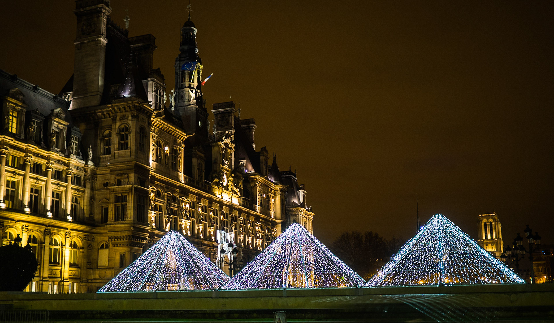Paris Hotel de Ville at night with Christmas street decorations