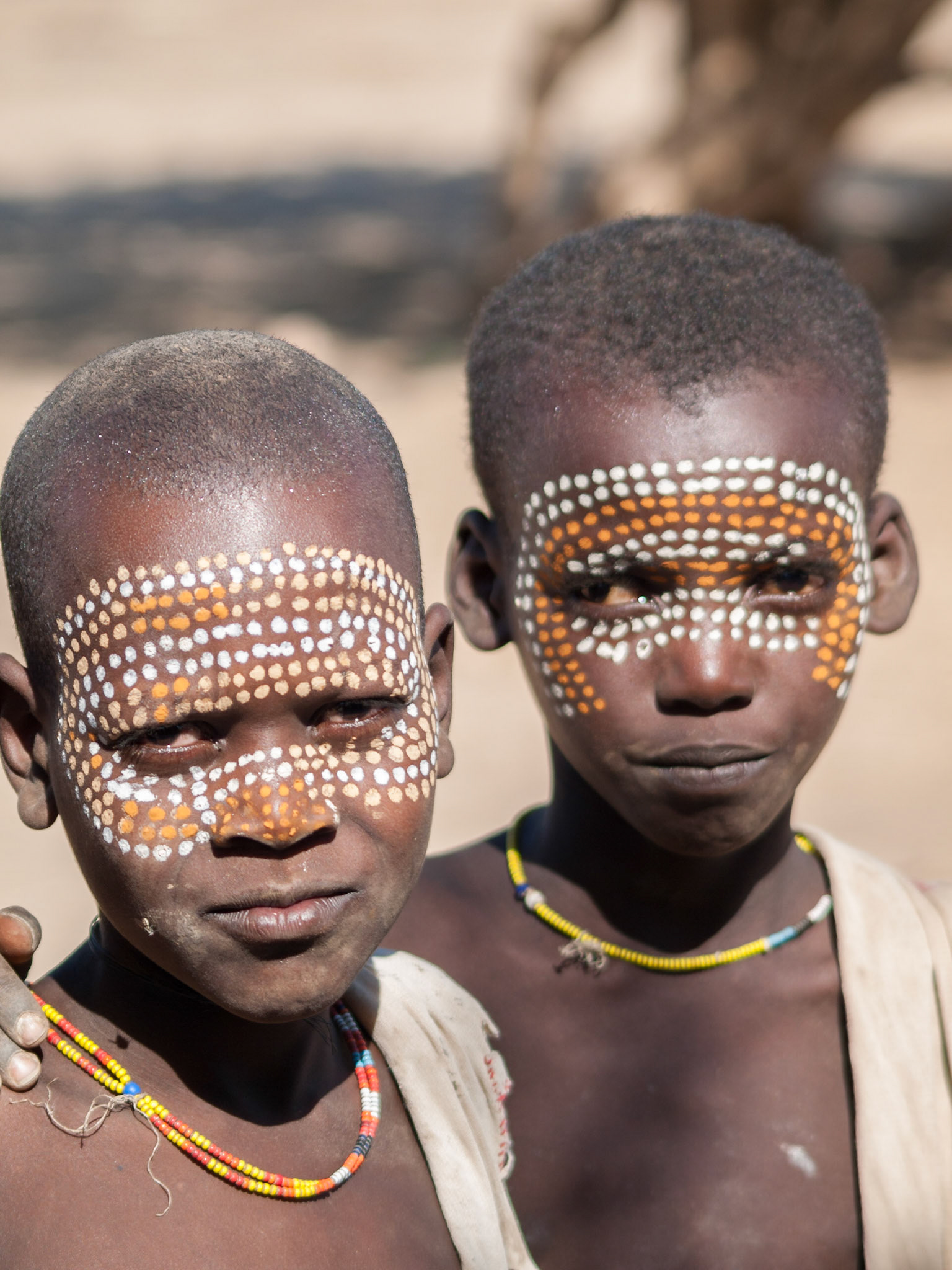 Portrait of two Arbore boys with painted faces