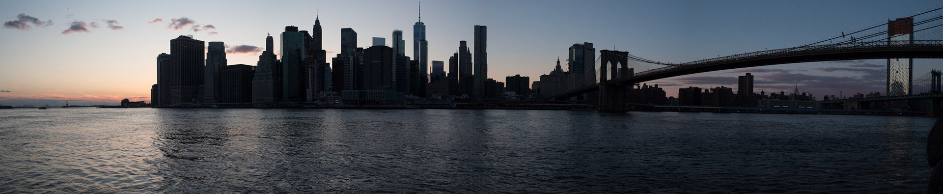Downtown Manhattan to Brooklyn Bridge panorama at sunset