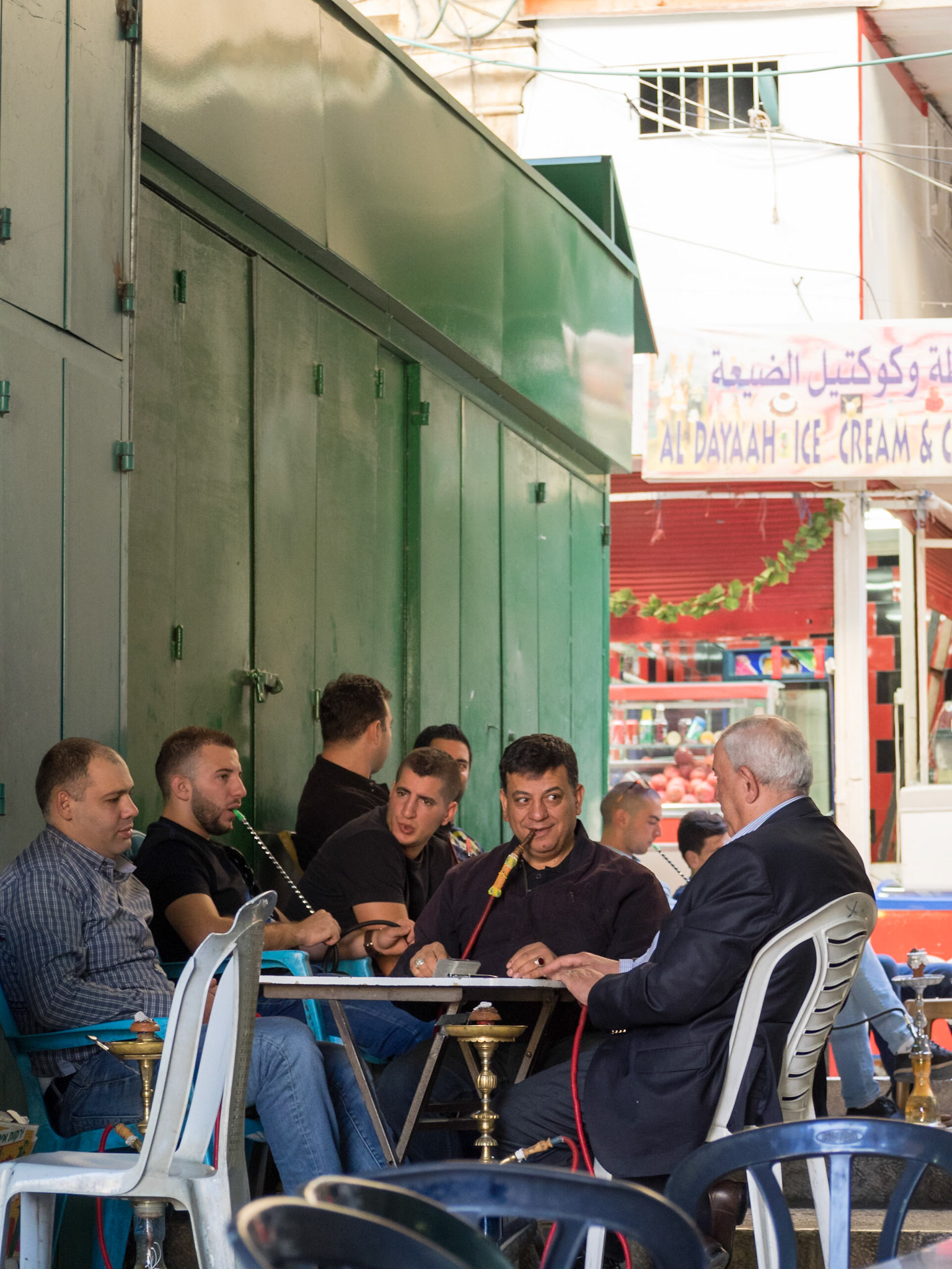 Muslim men smoking water pipe in the Muristan at Old Jerusalem