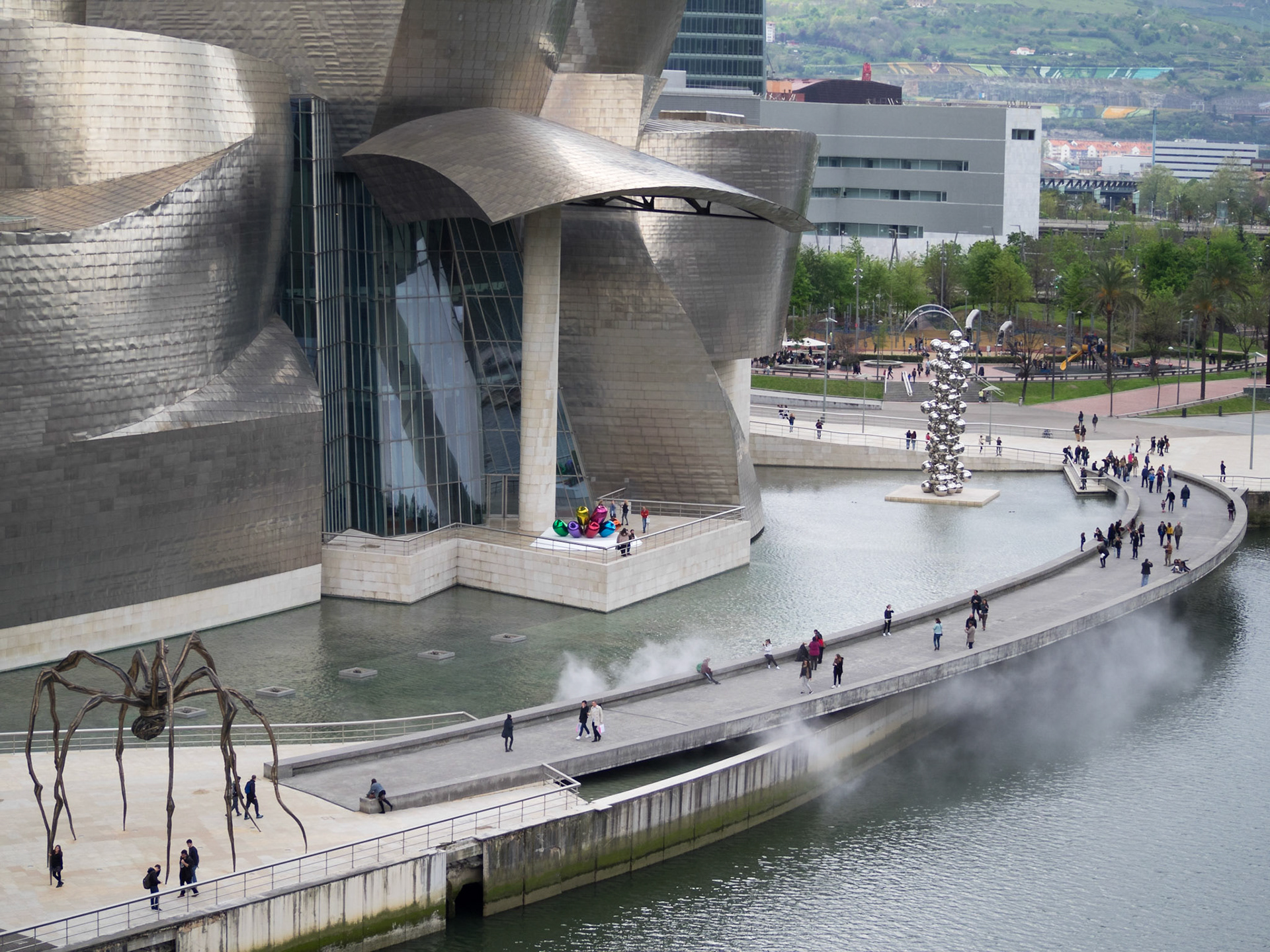 View of the Guggenheim Museum Bilbao bridge and public art by the Nervion river