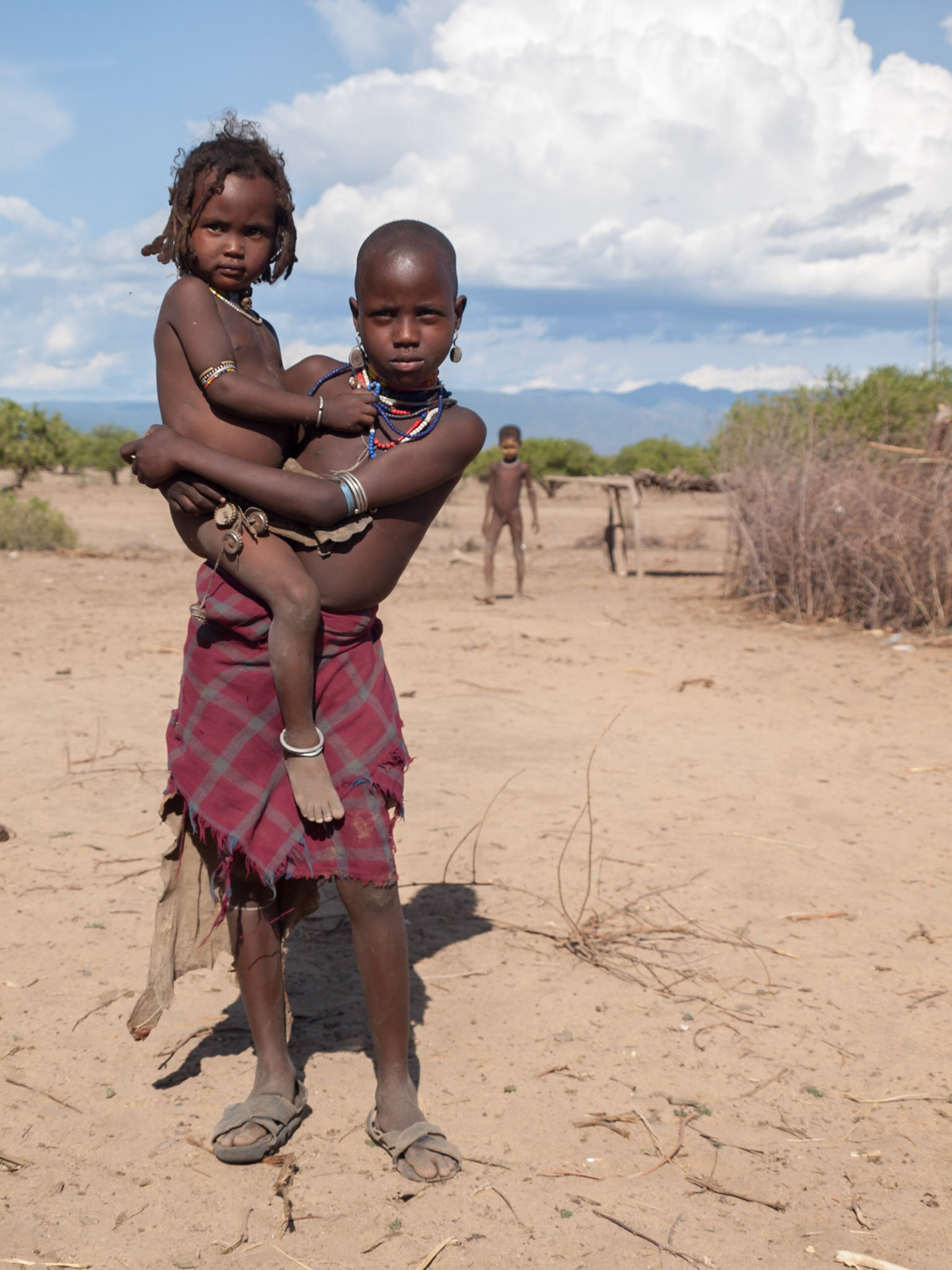 Young Arbore girl holding another child