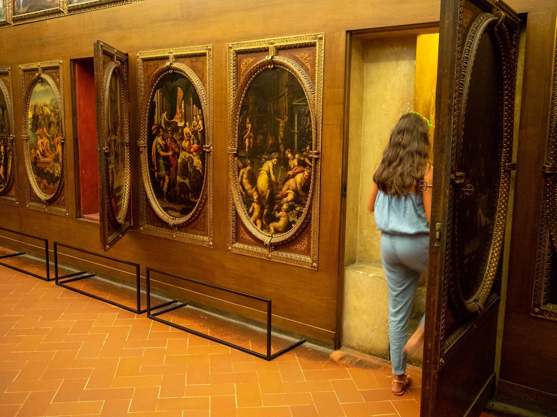 Exiting one secret door of the Study of Francesco I in the Palazzo Vecchio, Florence