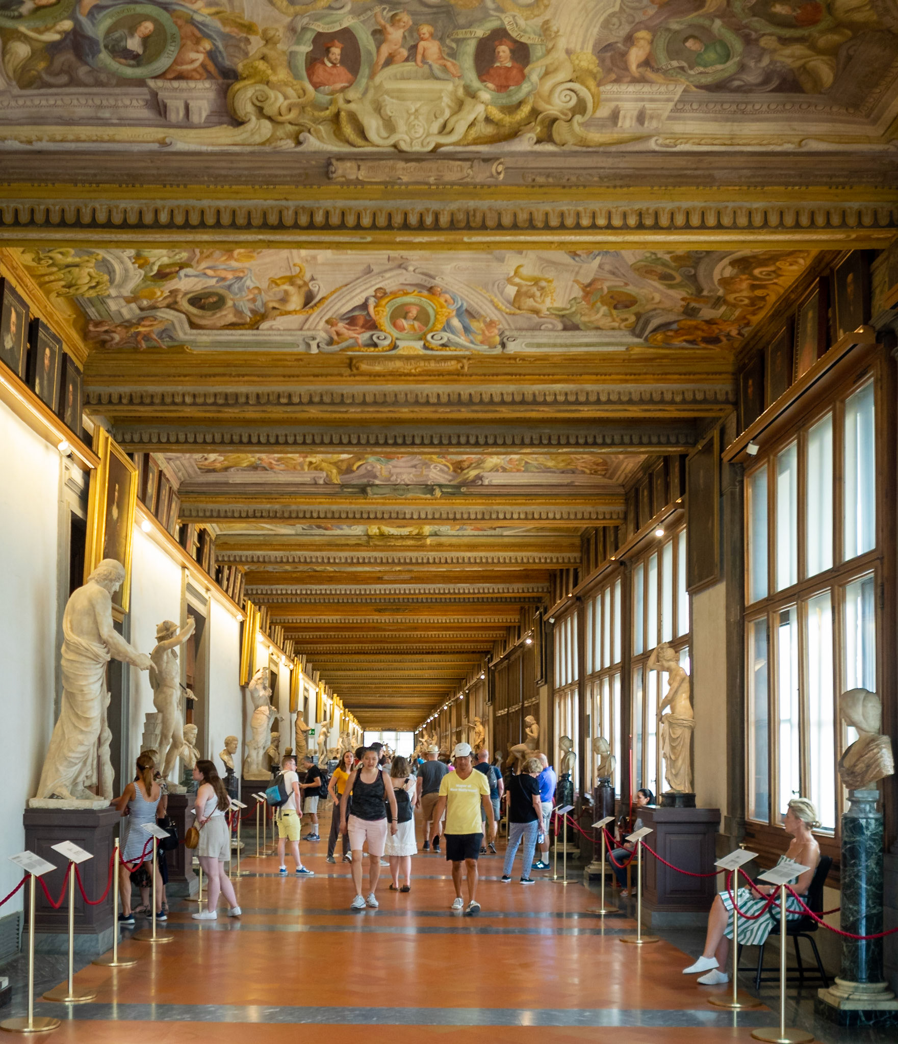Visitors admiring the art works at the Uffizi Galleries