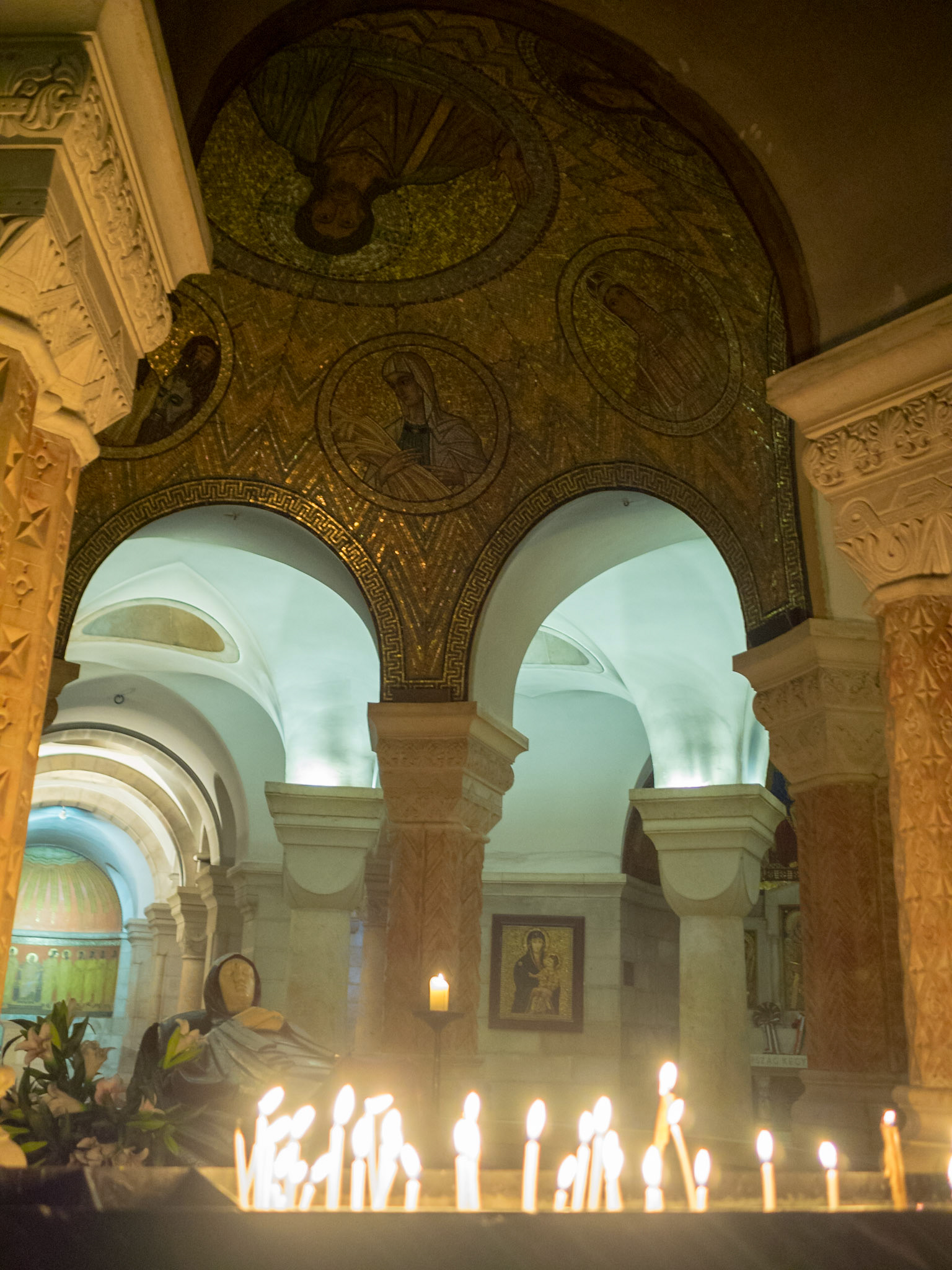 Lite candles by the Virgin Mary in the crypt of the Church and Monastery of the Dormition