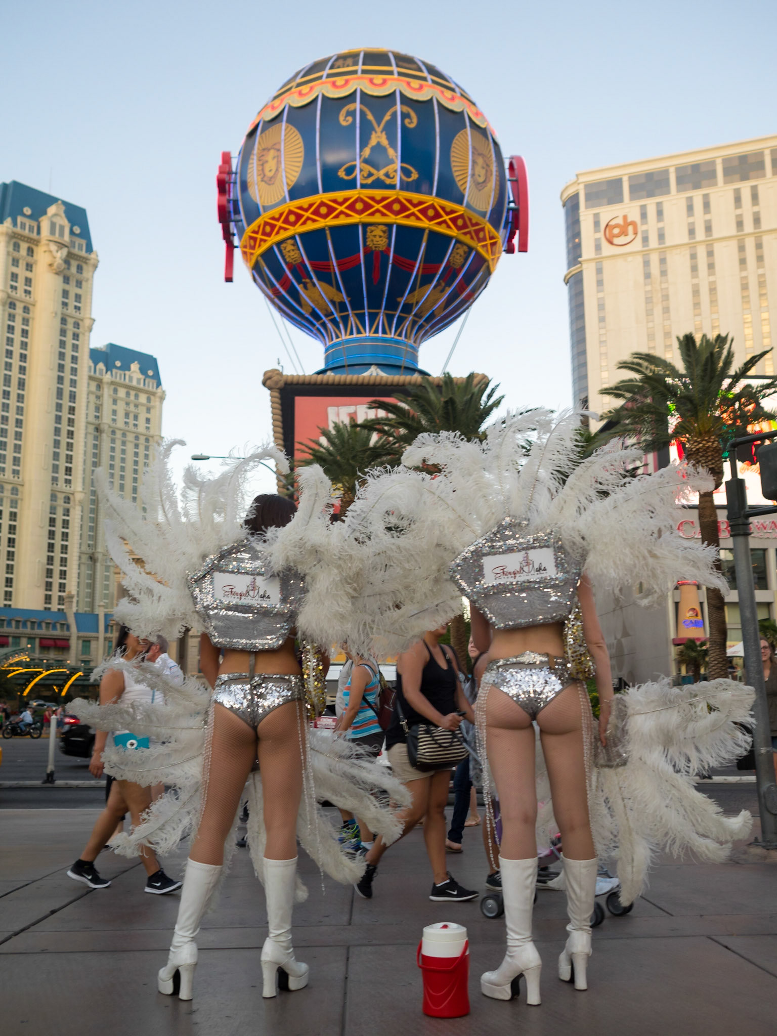 Two women dressed as showgirls in Las Vegas The Strip waiting to pose for pictures with tourists
