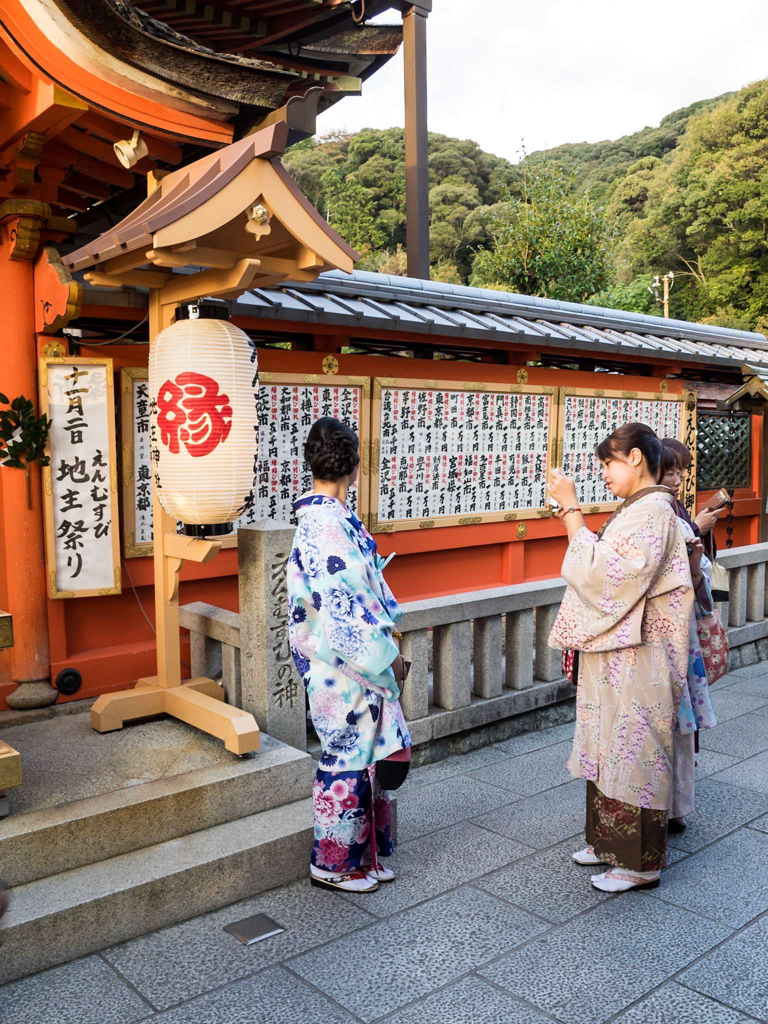 Women making offerings at Kiyomizu-dera Buddhism temple