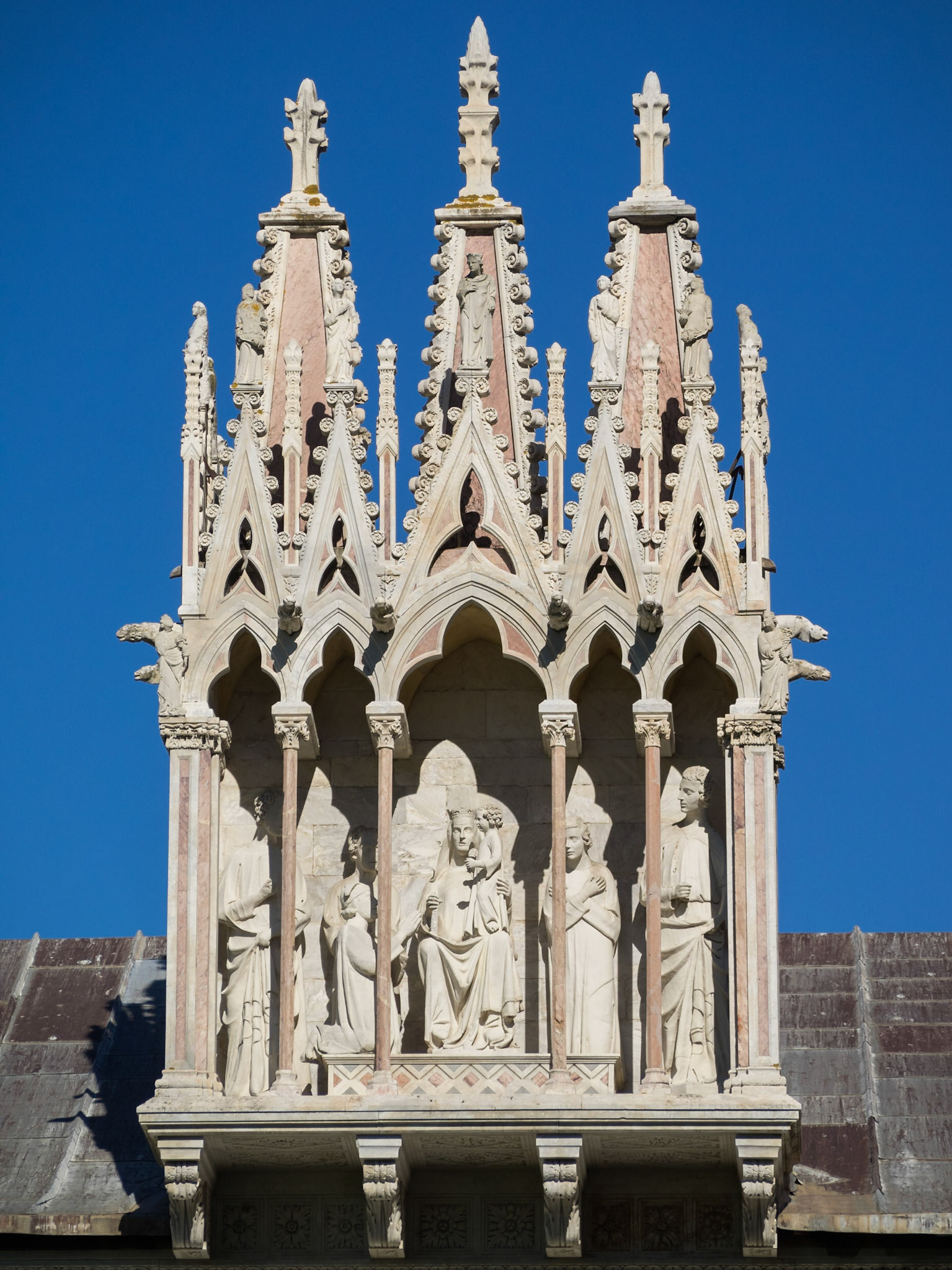 Virgin sculpture over the entrance to the Camposanto Monumentale