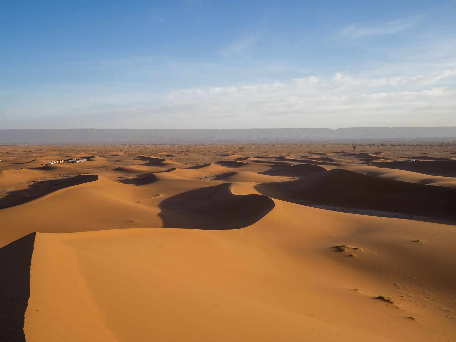Erg Chegaga sand dunes with the Anti-Atlas Mountains in the far horizon, Morocco