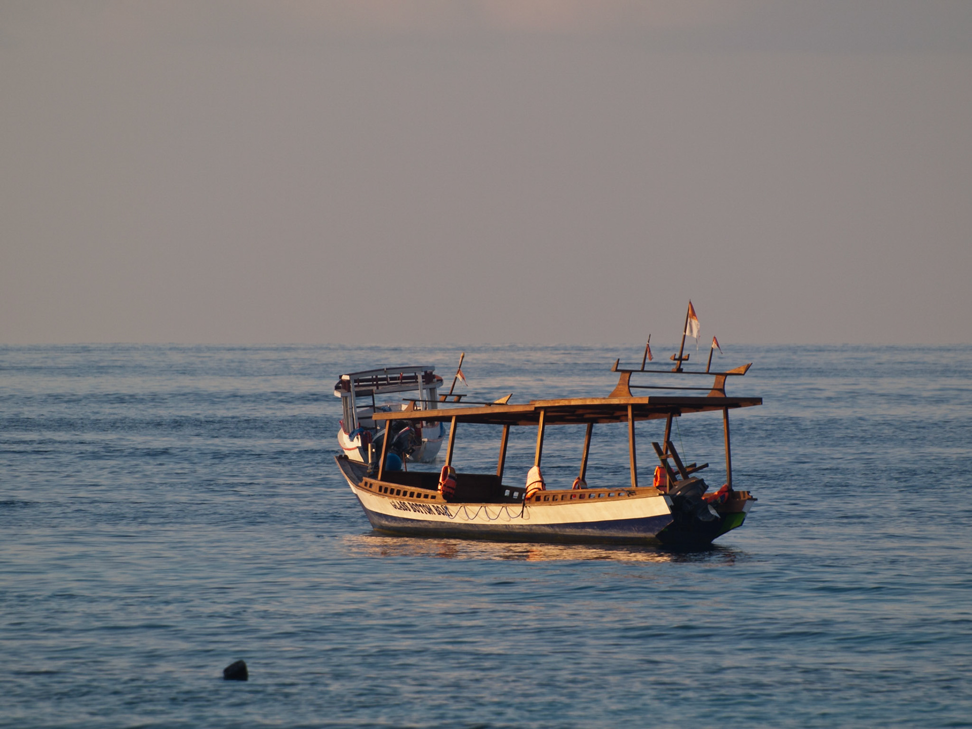 Boat in the sea in sunset light