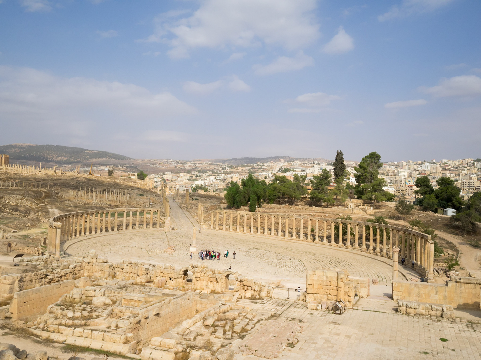 Oval Forum and Cardo of Jerash Roman city with the new city in background