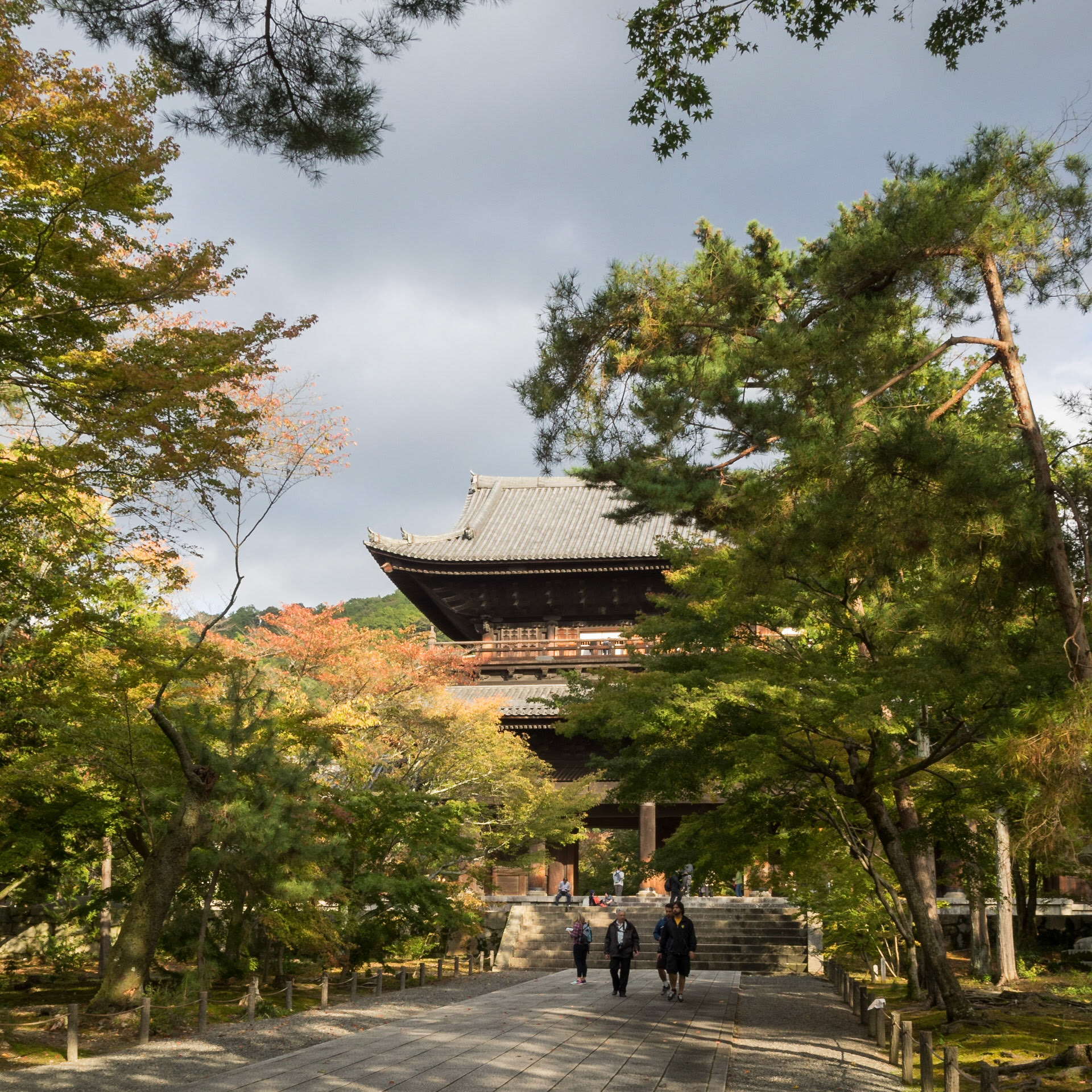 Entrance to the Nanzen-ji temple fround with San-mon Zen gate behind the trees