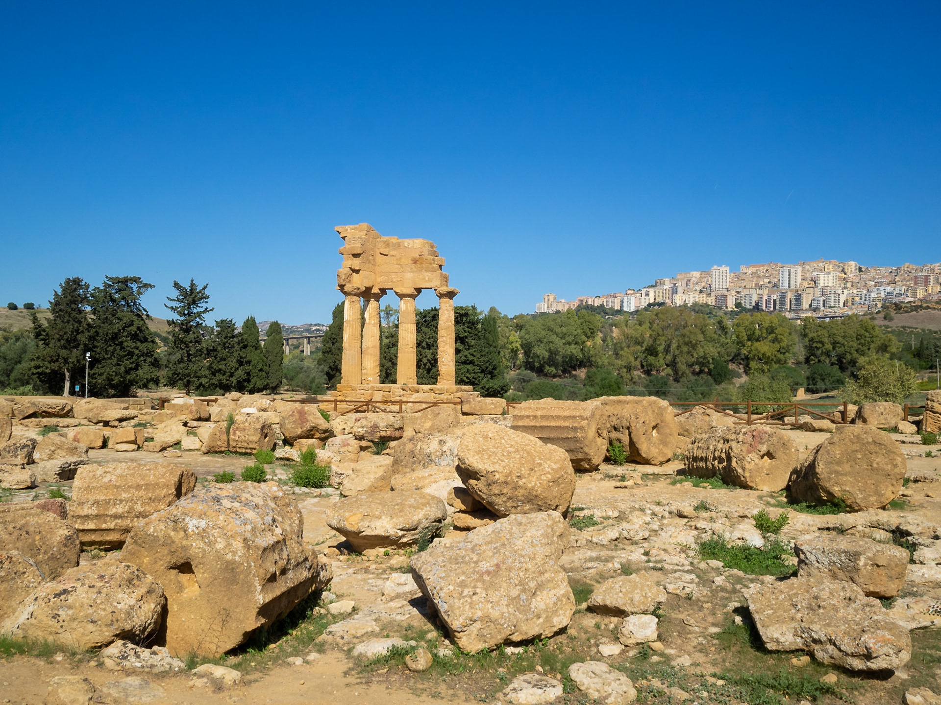 The reconstructed columns of Temple of Castor and Pollux by the scattered remains of the temple