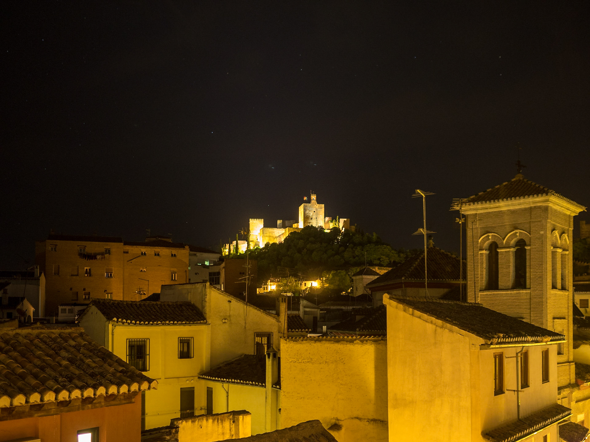 Night view over Granada roofs to Allambra