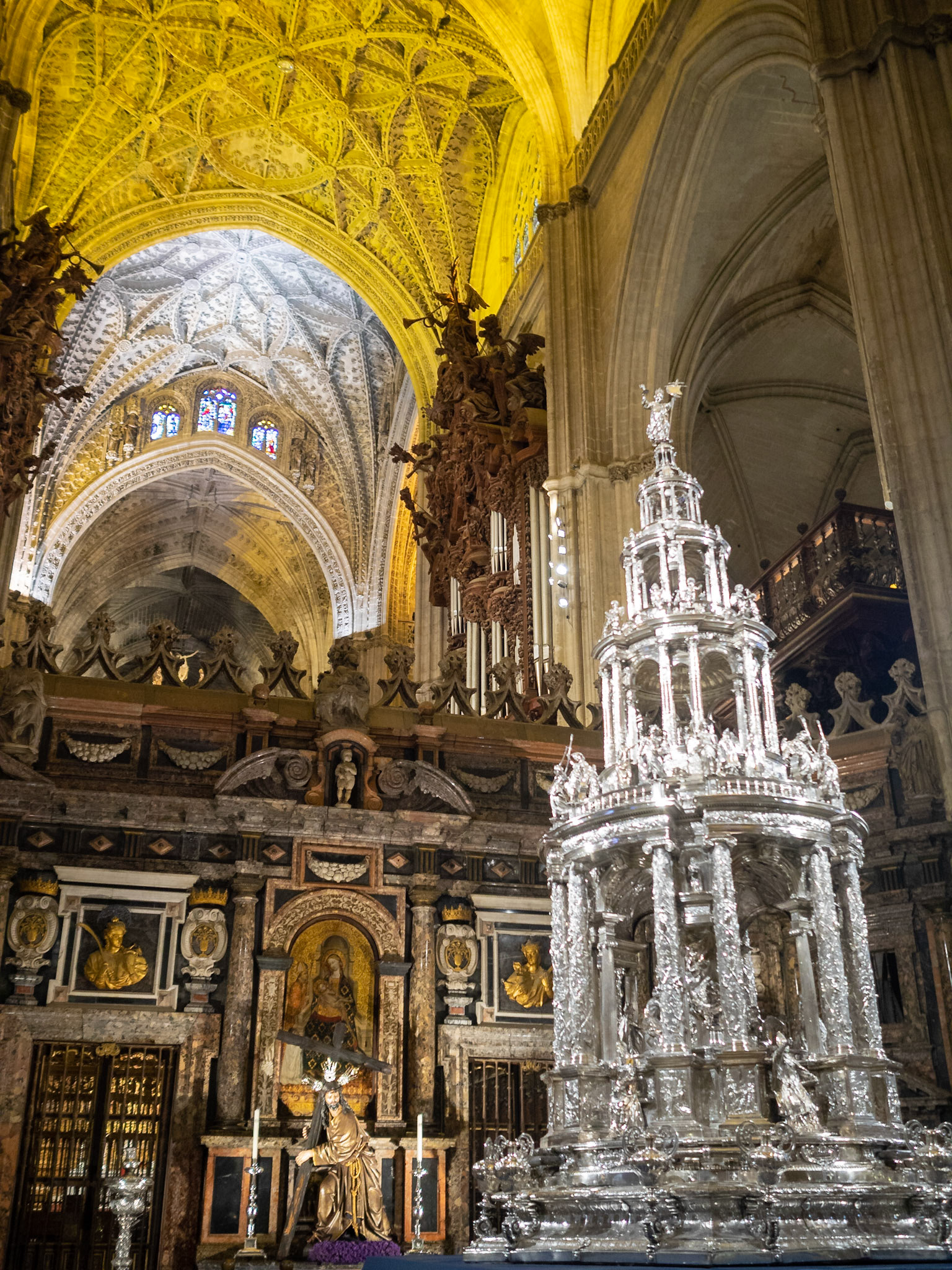 Baroque style retrochoir of the Seville Cathedral benind a silver custody