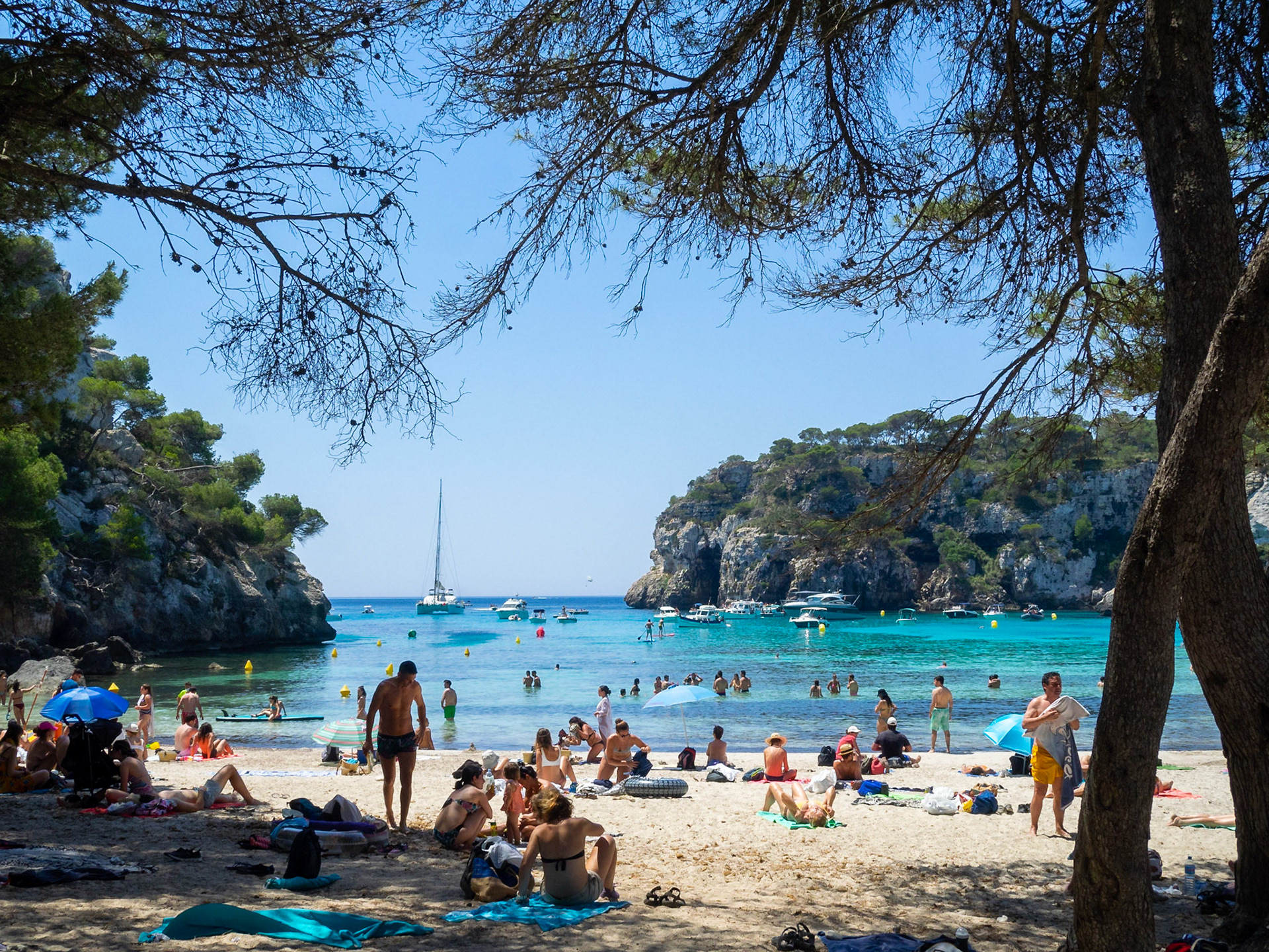 Sunbathers in Cala Macarella, Menorca