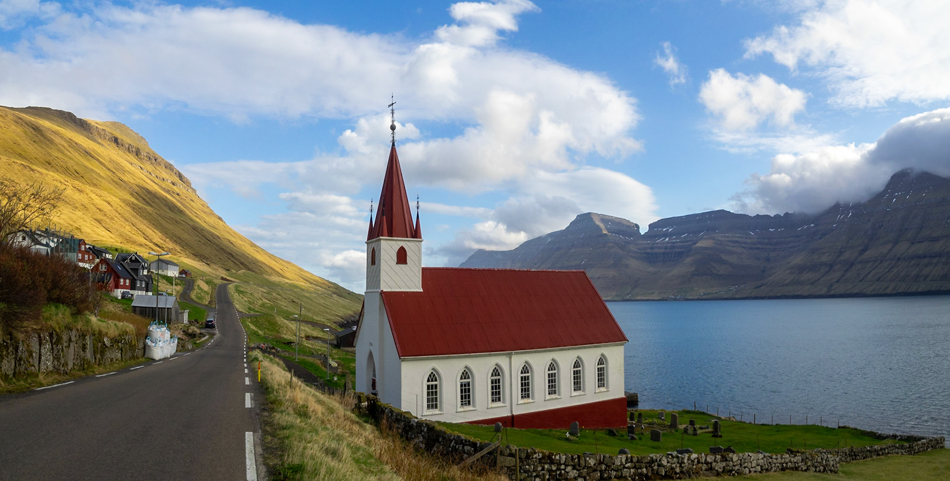 Húsar church by Kalsoyarfjørður fjord  and the road to the north