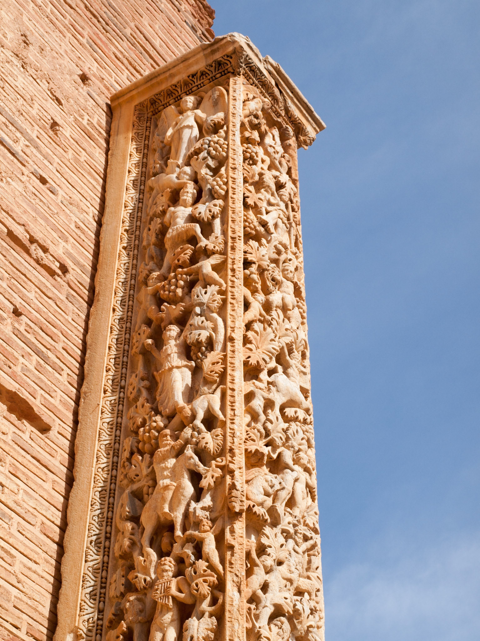 Bacus bass relief in a column in the Severan Basilica in Leptis Magna