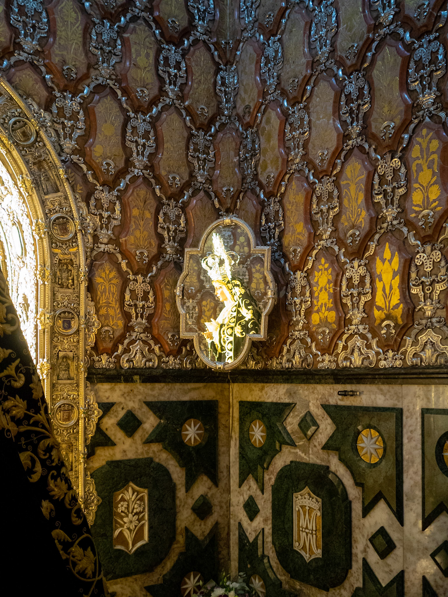 Goldsmith work of the interior walls from the high altar of Basilica de la Macarena, with Virgin reflected in the mirror, Seville