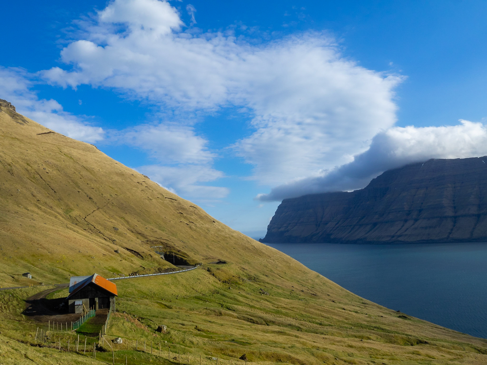 A tunnel cutting through the mountain in Kalsoy
