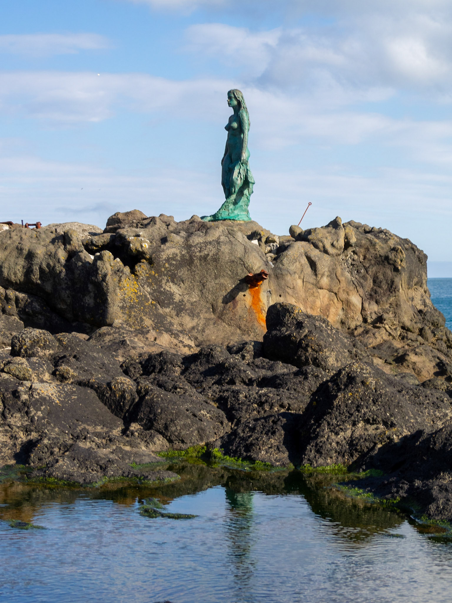 Kópakonan, the seal woman, statue over the rocks
