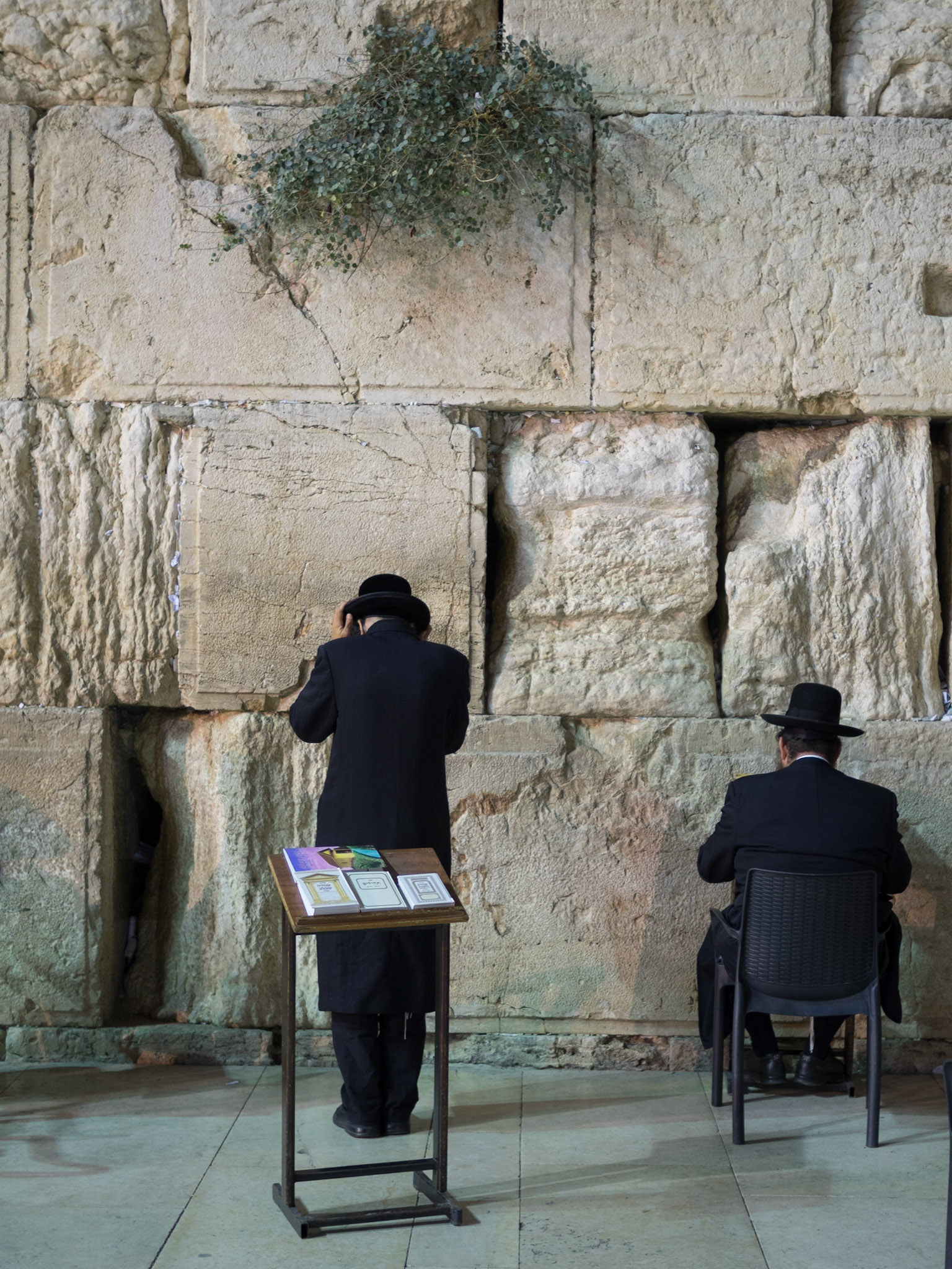 Two Orthodox Jews pray by the Wailing Wall