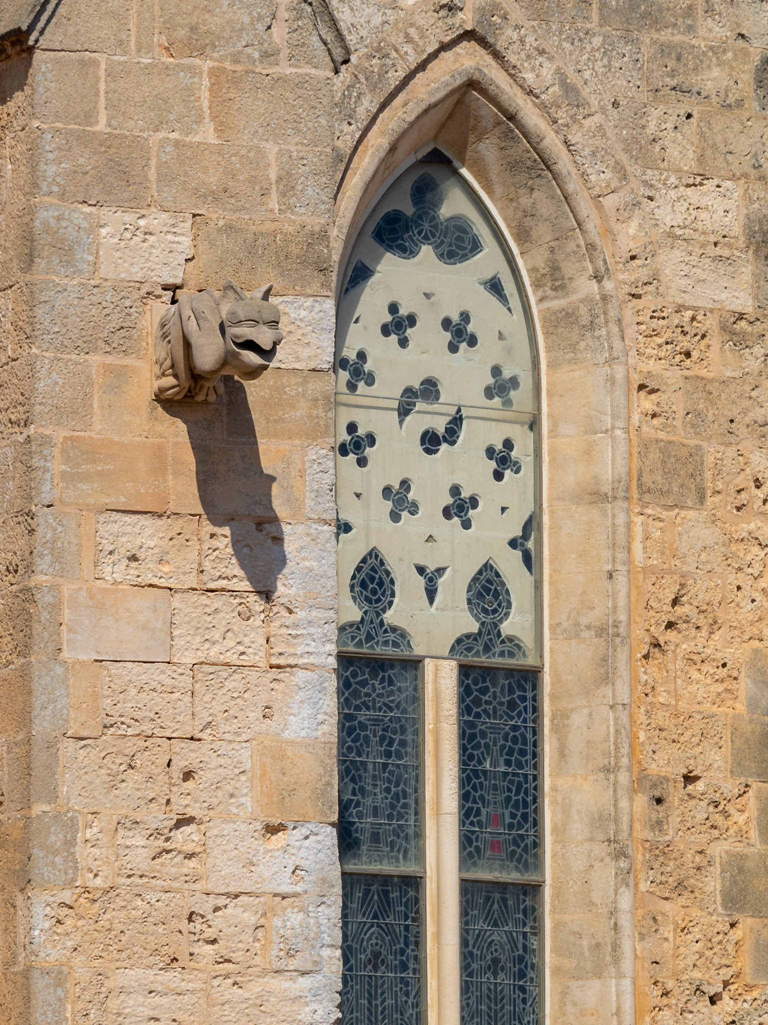 Gargoyle and gothic window of the Ciutadella de Menorca Cathedral