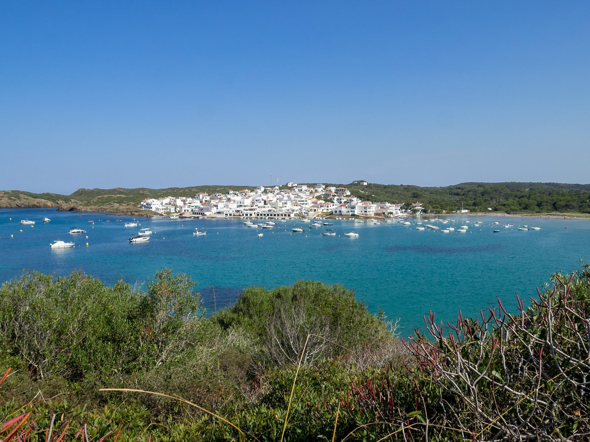 Es Grau seen from across the bay, Menorca
