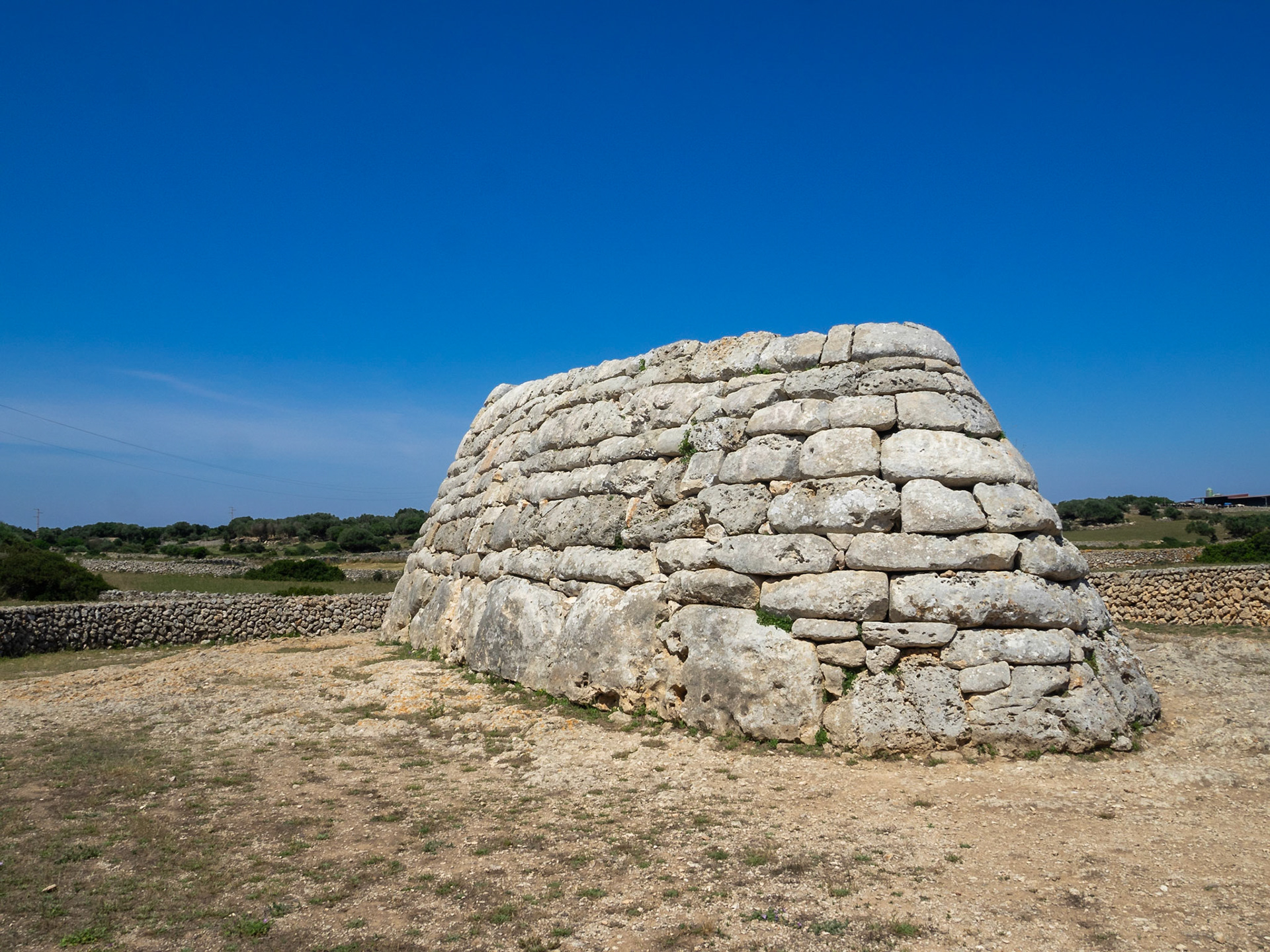 Naveta des Tudons, megalithic chamber tomb seen from the back, Menorca