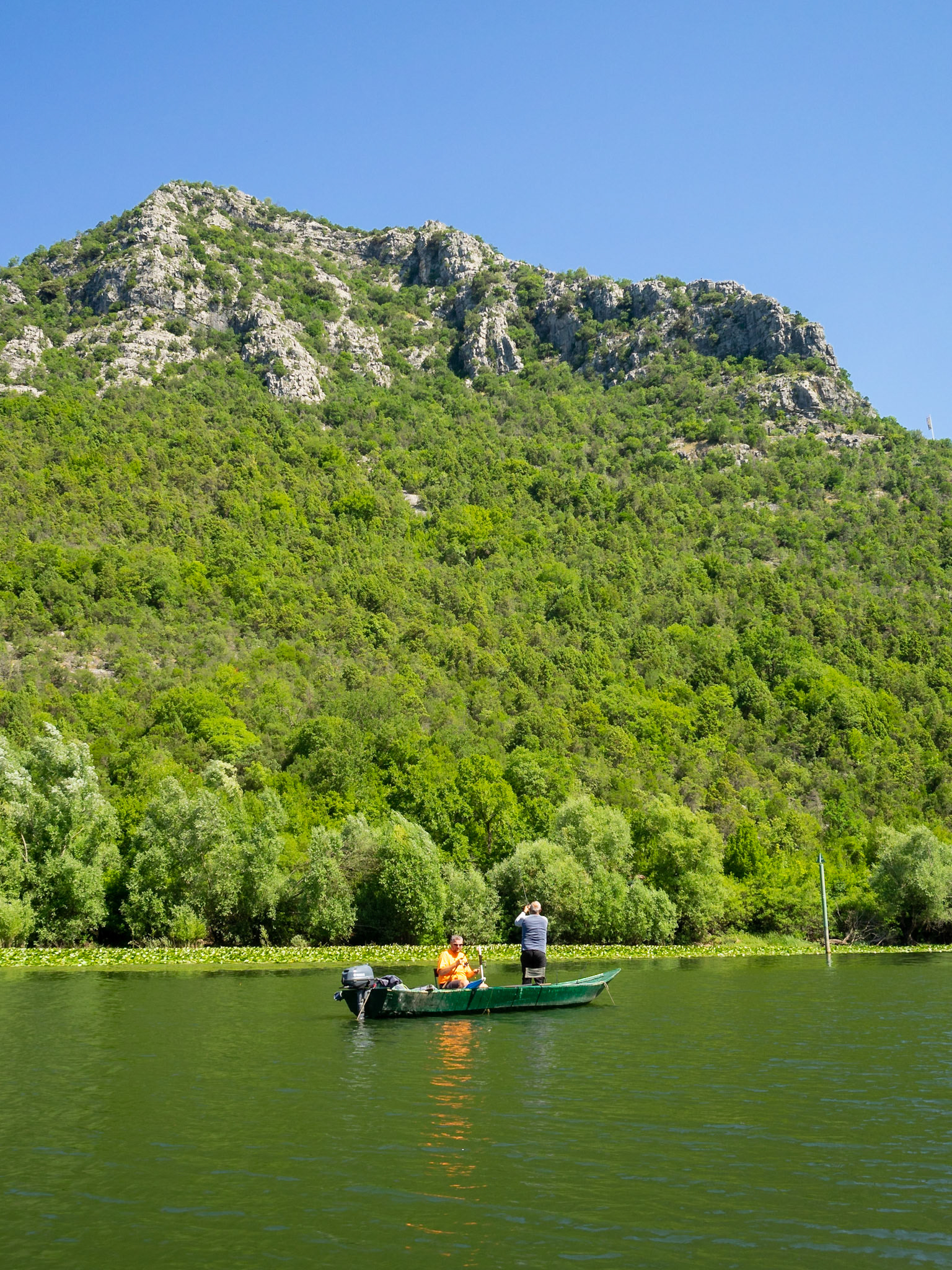 Men fishing in Rijeka Crnojevića