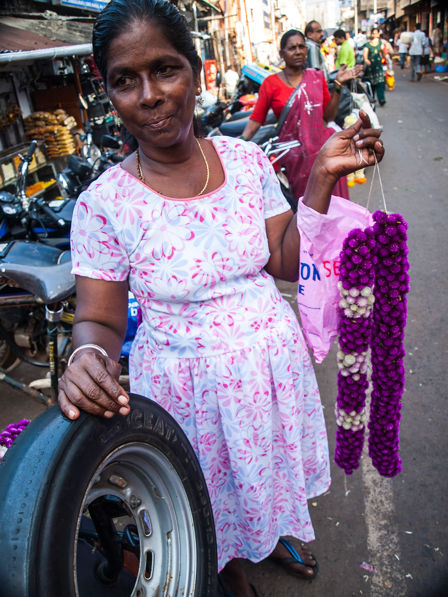 Woman selling flowers in Margao market